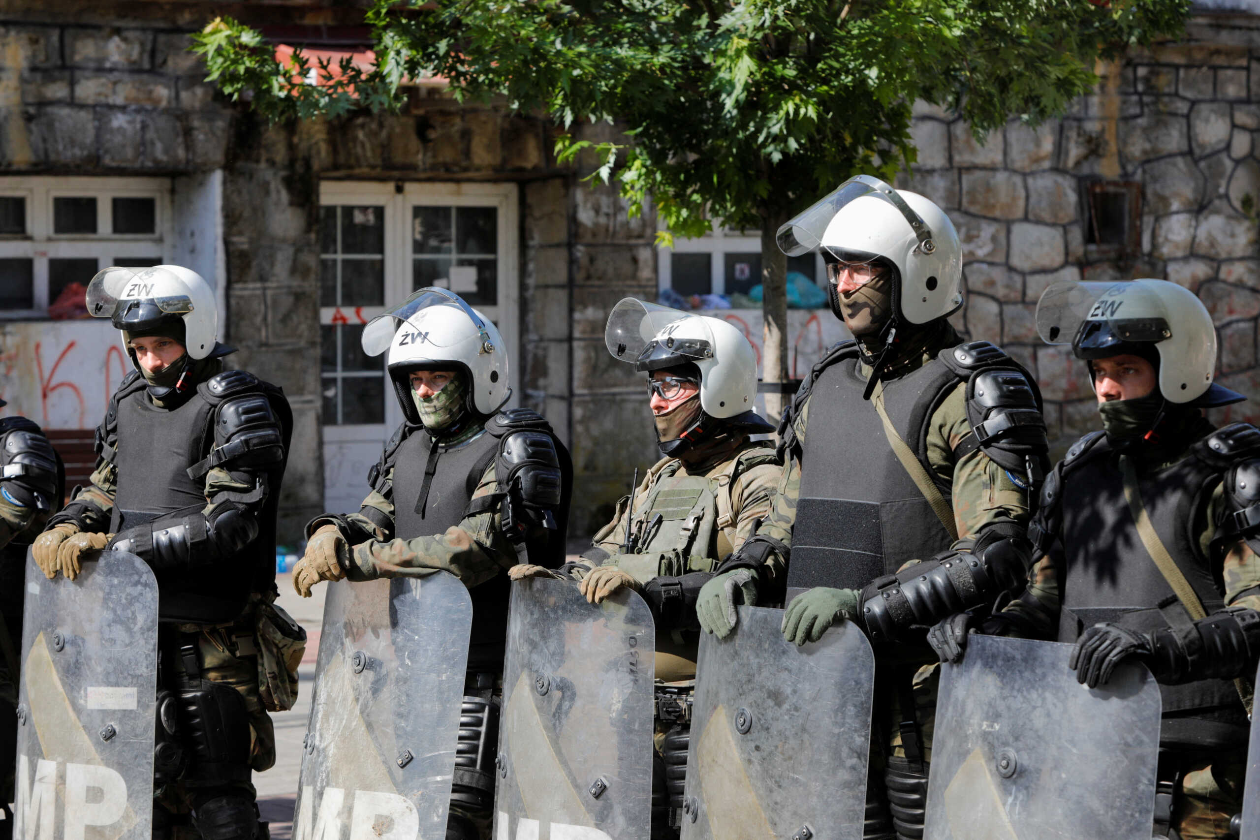 Polish Kosovo Force (KFOR) soldiers stand guard at a municipal office in Zvecan, Kosovo May 30, 2023. REUTERS