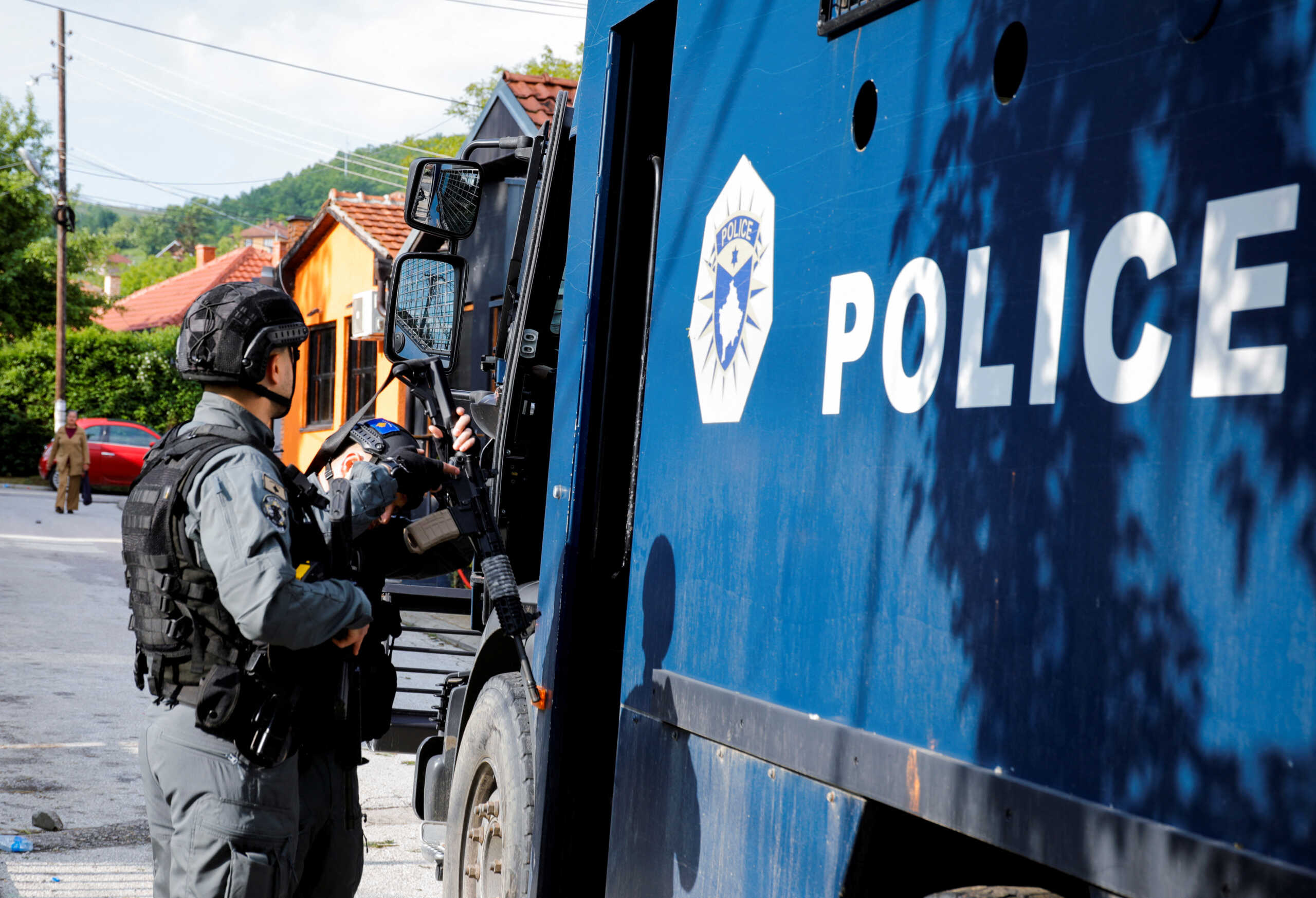 Members of Kosovo special police forces stand next to a vehicle as they guard the municipal offices in Zvecan after ethnic Serb protestors tried to prevent a newly-elected ethnic Albanian mayor from entering the office in Zvecan, Kosovo, May 27, 2023.REUTERS