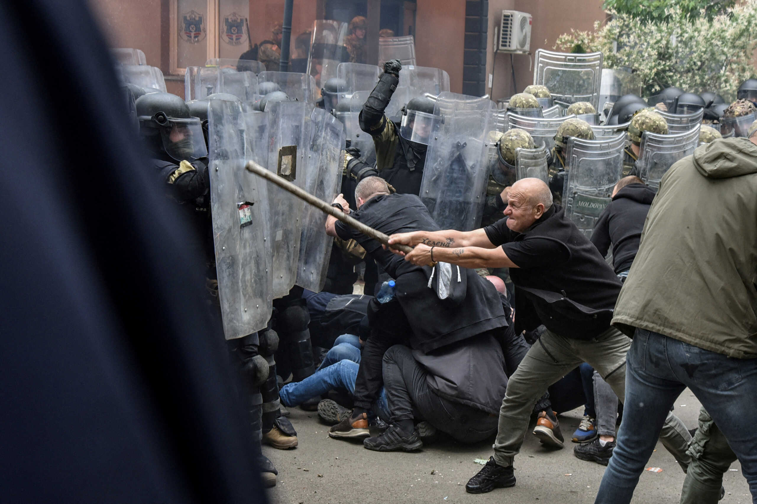 NATO Kosovo Force (KFOR) soldiers clash with local Kosovo Serb protesters at the entrance of the municipality office, in the town of Zvecan, Kosovo, May 29, 2023. REUTERS