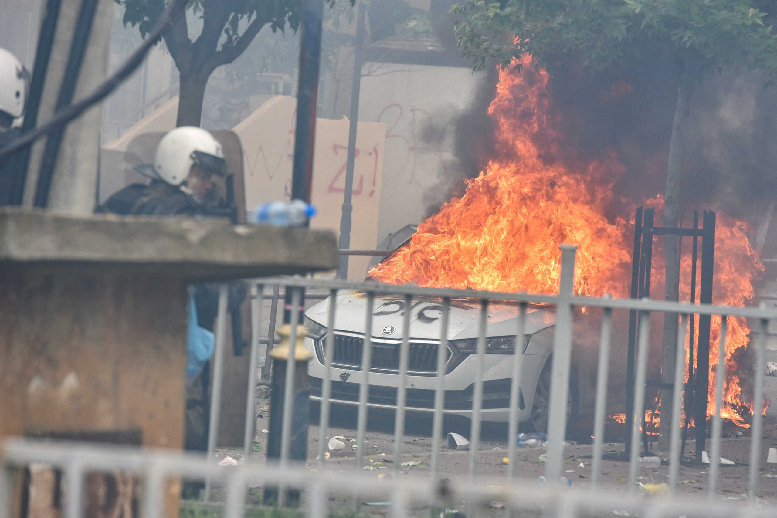 A car burns after NATO Kosovo Force (KFOR) soldiers clashed with local Kosovo Serb protesters at the entrance of the municipality office, in the town of Zvecan, Kosovo, May 29, 2023. REUTERS