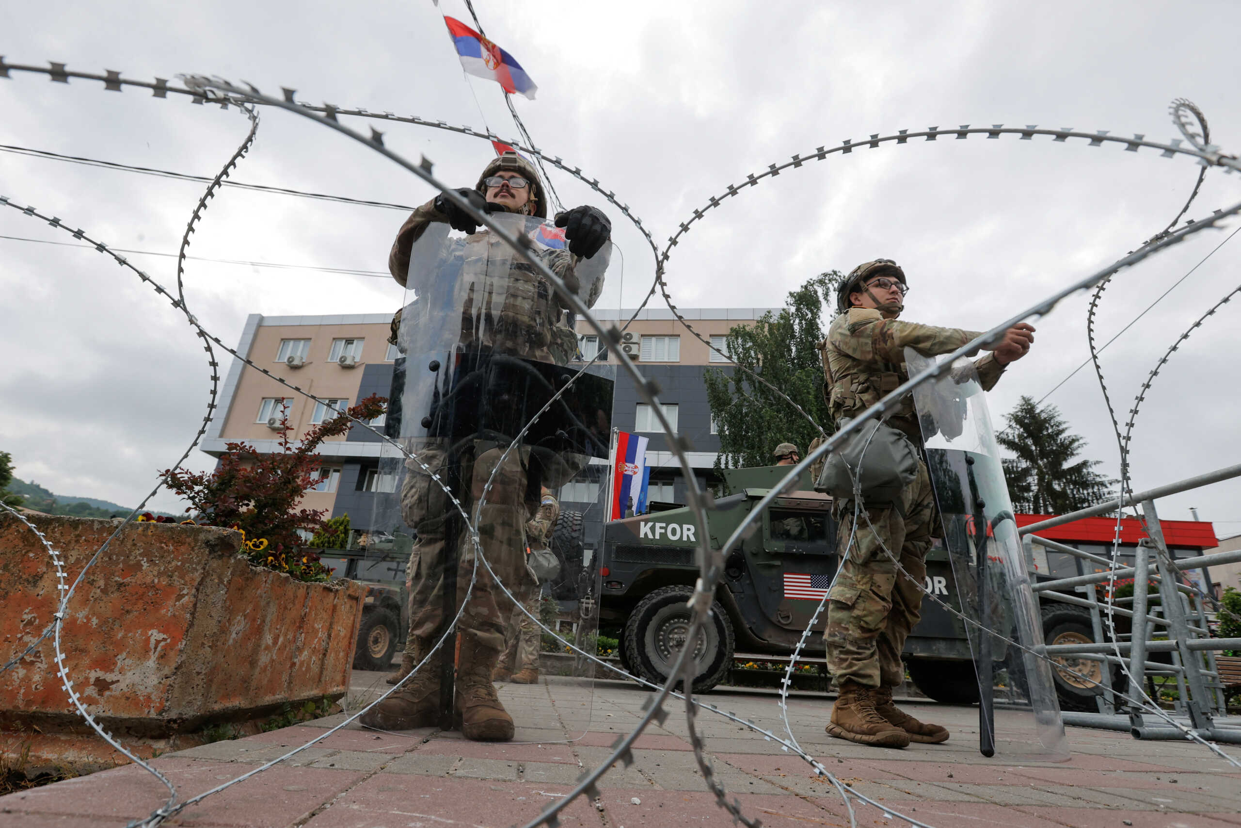U.S. KFOR soldiers stand guard in front of the municipality office, in the town of Leposavic, Kosovo, May 29, 2023. REUTERS