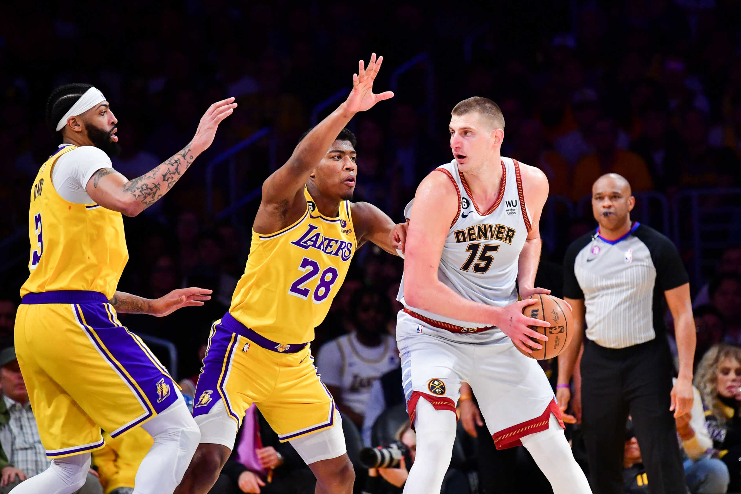 May 22, 2023; Los Angeles, California, USA; Denver Nuggets center Nikola Jokic (15) fights for position against Los Angeles Lakers forward Jarred Vanderbilt (2) during the third quarter in game four of the Western Conference Finals for the 2023 NBA playoffs at Crypto.com Arena. Mandatory Credit: Gary A. Vasquez-USA TODAY Sports