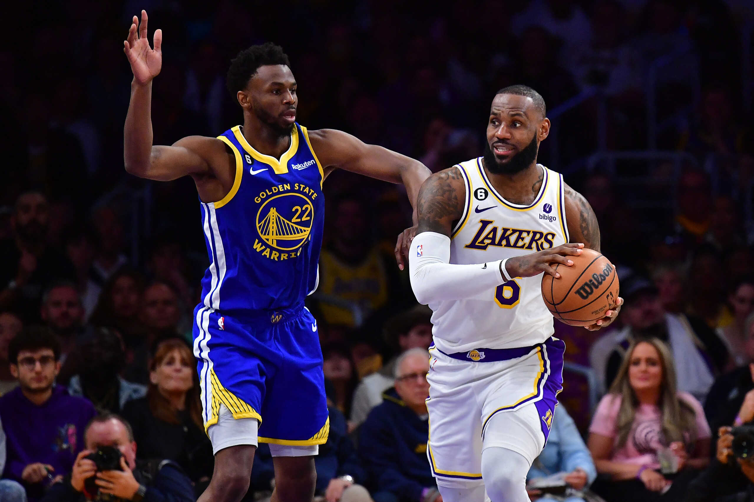 May 6, 2023; Los Angeles, California, USA; Los Angeles Lakers forward LeBron James (6) moves the ball against Golden State Warriors forward Andrew Wiggins (22) during the second half in game three of the 2023 NBA playoffs at Crypto.com Arena. Mandatory Credit: Gary A. Vasquez-USA TODAY Sports