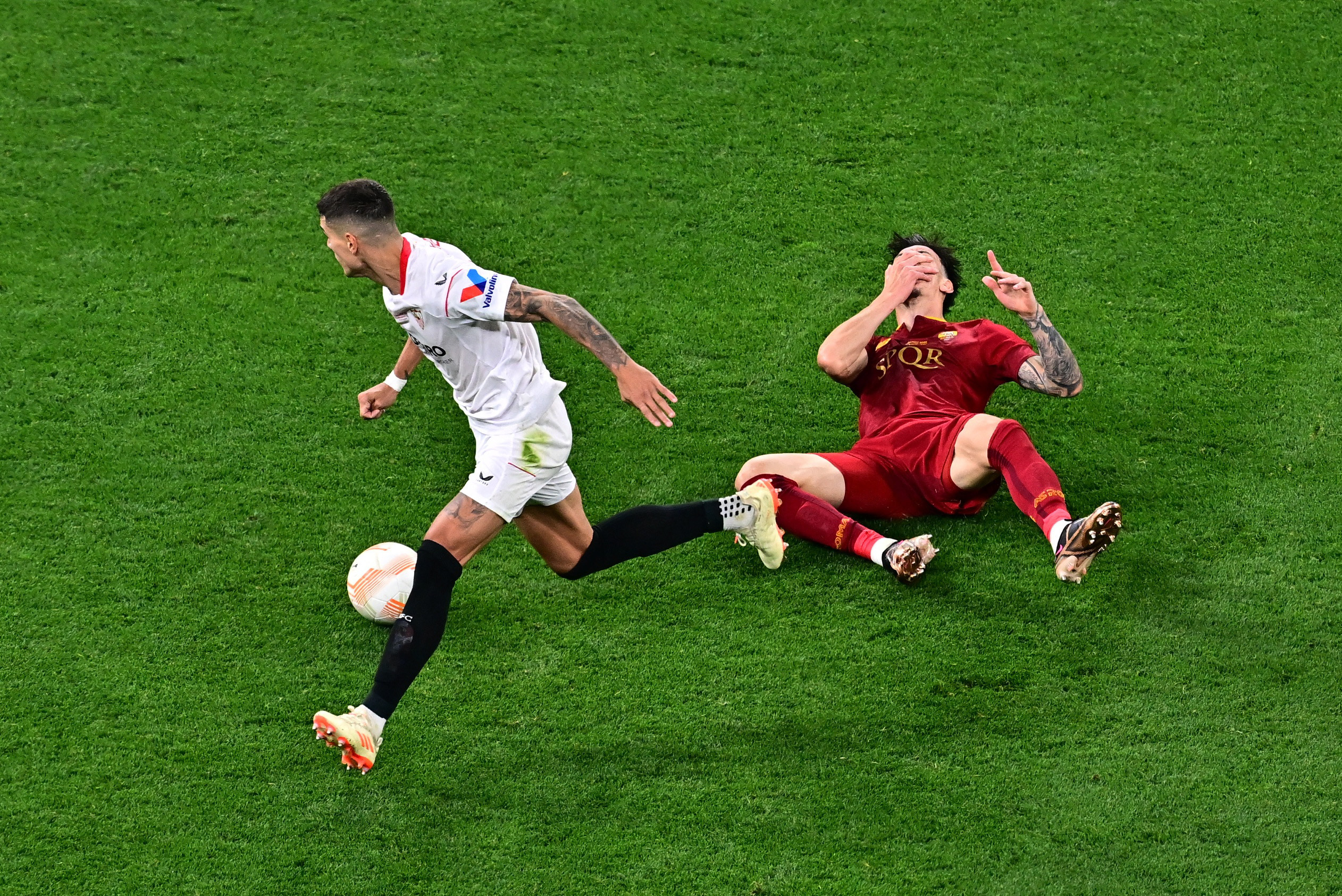 Soccer Football - Europa League - Final - Sevilla v AS Roma - Puskas Arena, Budapest, Hungary - May 31, 2023 AS Roma's Roger Ibanez reacts after sustaining an injury REUTERS