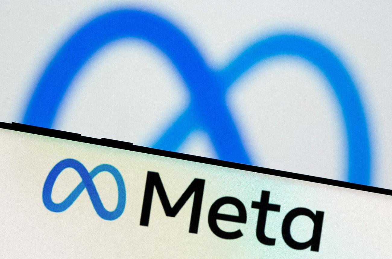 FILE PHOTO: Meta Platforms Inc's logo is seen on a smartphone in this illustration picture taken October 28, 2021. REUTERS