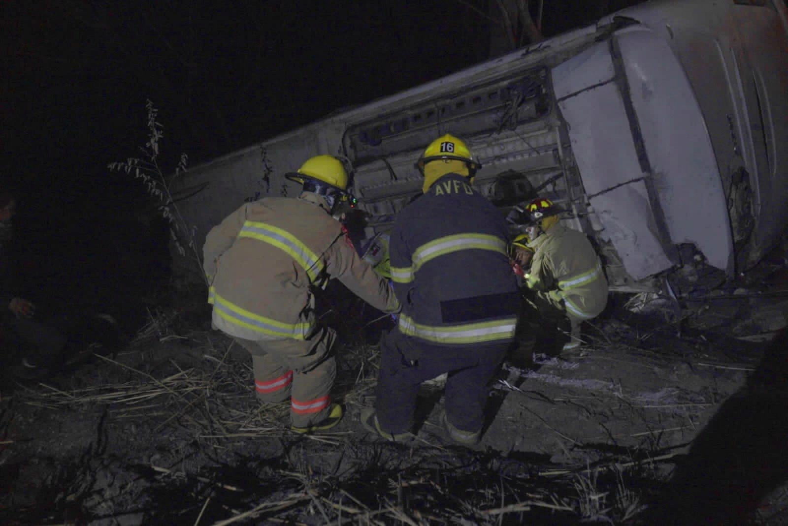 Emergency personnel work on the site where a bus carrying tourists traveling to Guayabitos overturned, in Compostela, Nayarit state, Mexico in this handout image obtained from social media April 30, 2023. Secretaria de Seguridad y Proteccion Ciudadana de Nayarit