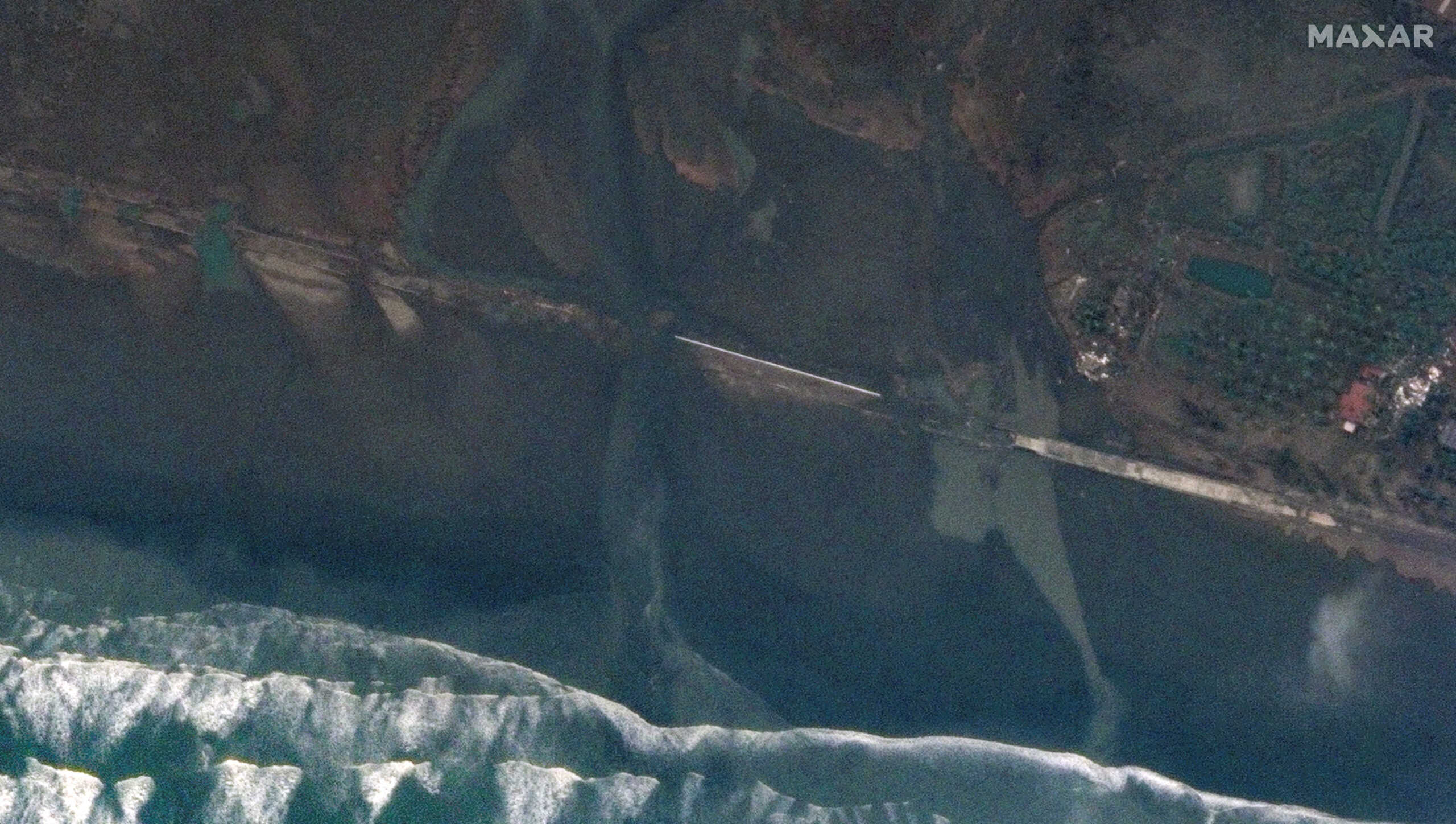A satellite image shows a bridge after the landfall of Cyclone Mocha, in Sittwe, Myanmar May 15, 2023. Maxar Technologies