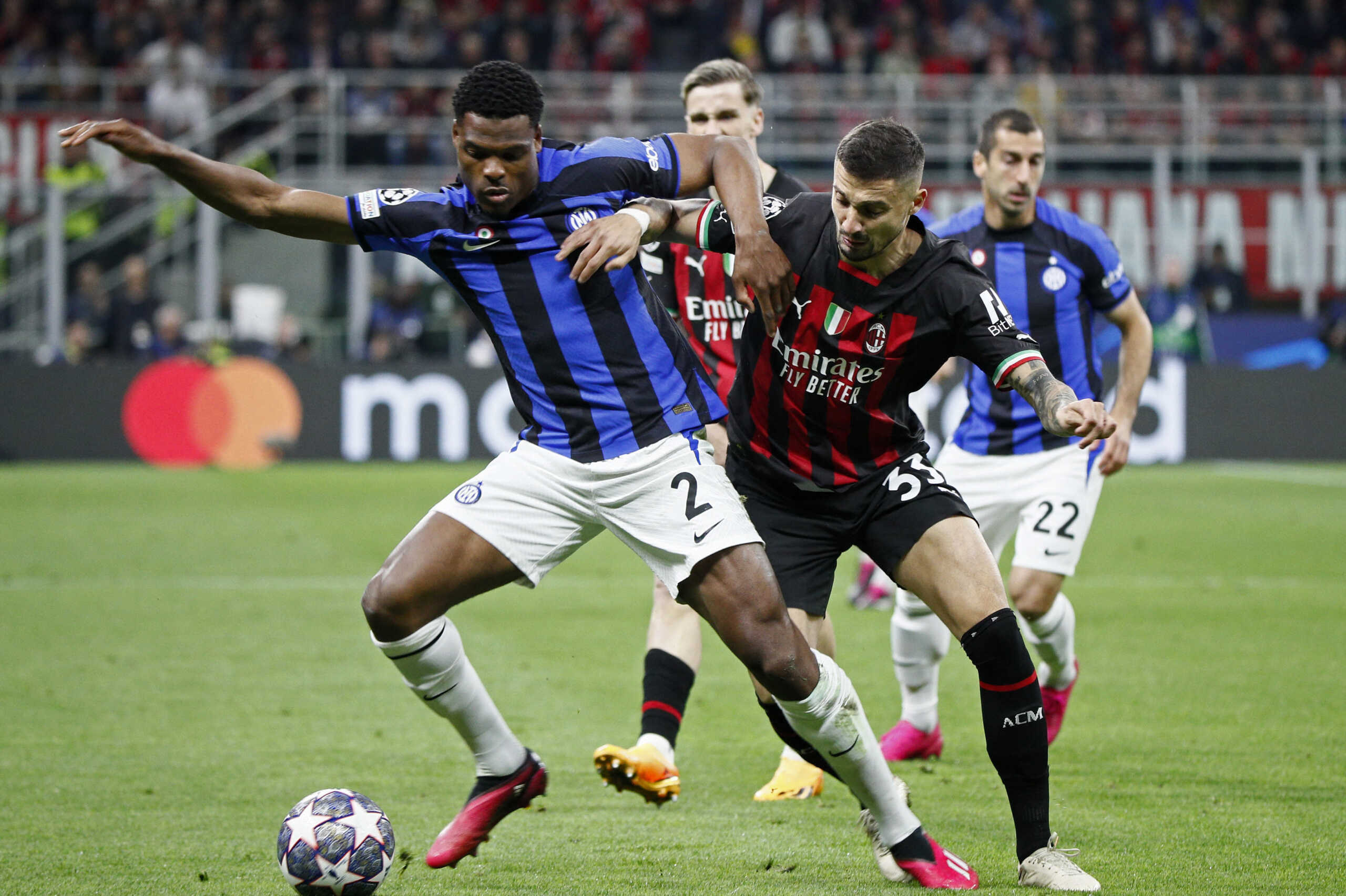 Soccer Football - Champions League - Semi Final - First Leg - AC Milan v Inter Milan - San Siro, Milan, Italy - May 10, 2023 Inter Milan's Denzel Dumfries in action with AC Milan's Rade Krunic REUTERS