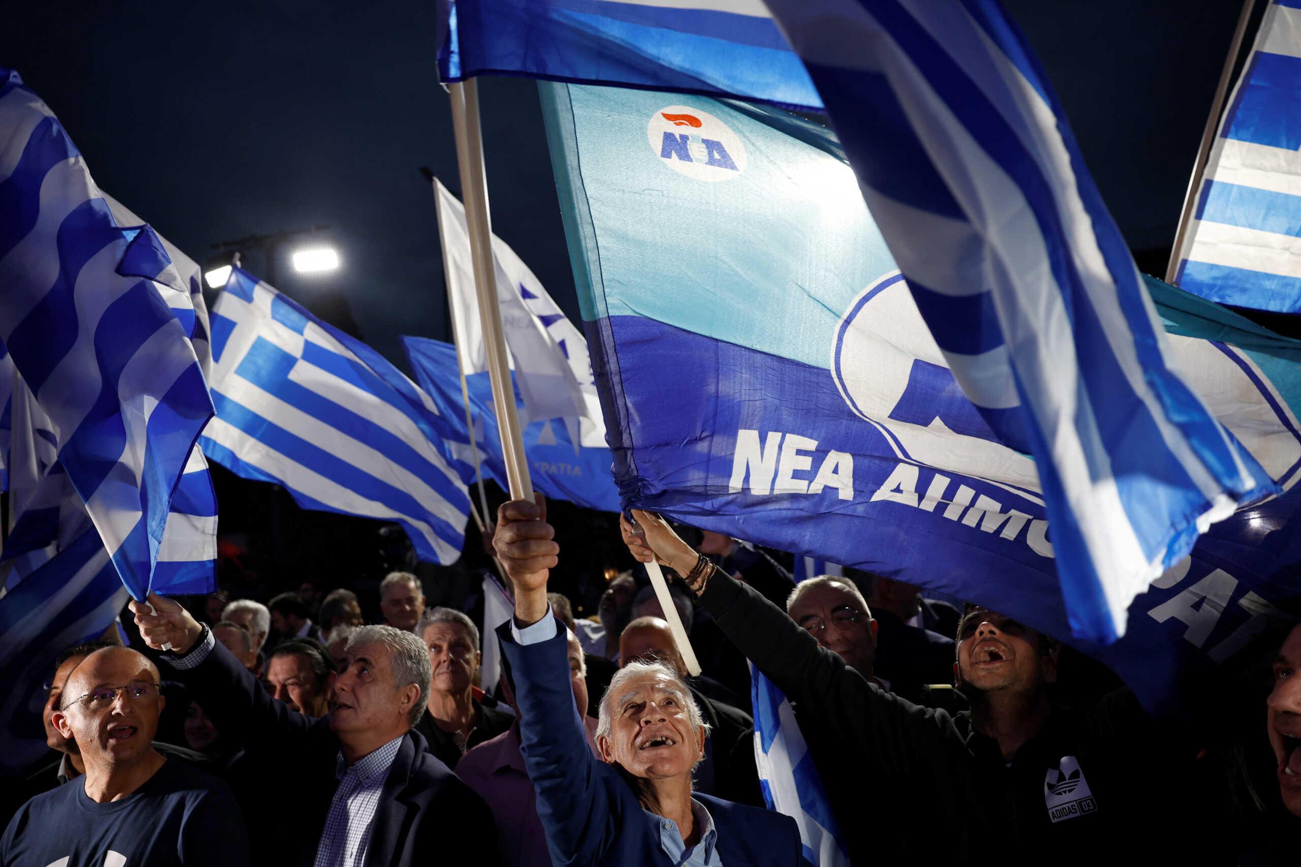 Supporters of New Democracy conservative party react at the party's headquarters after the announcement of the first exit polls, in Athens, Greece, May 21, 2023.  REUTERS