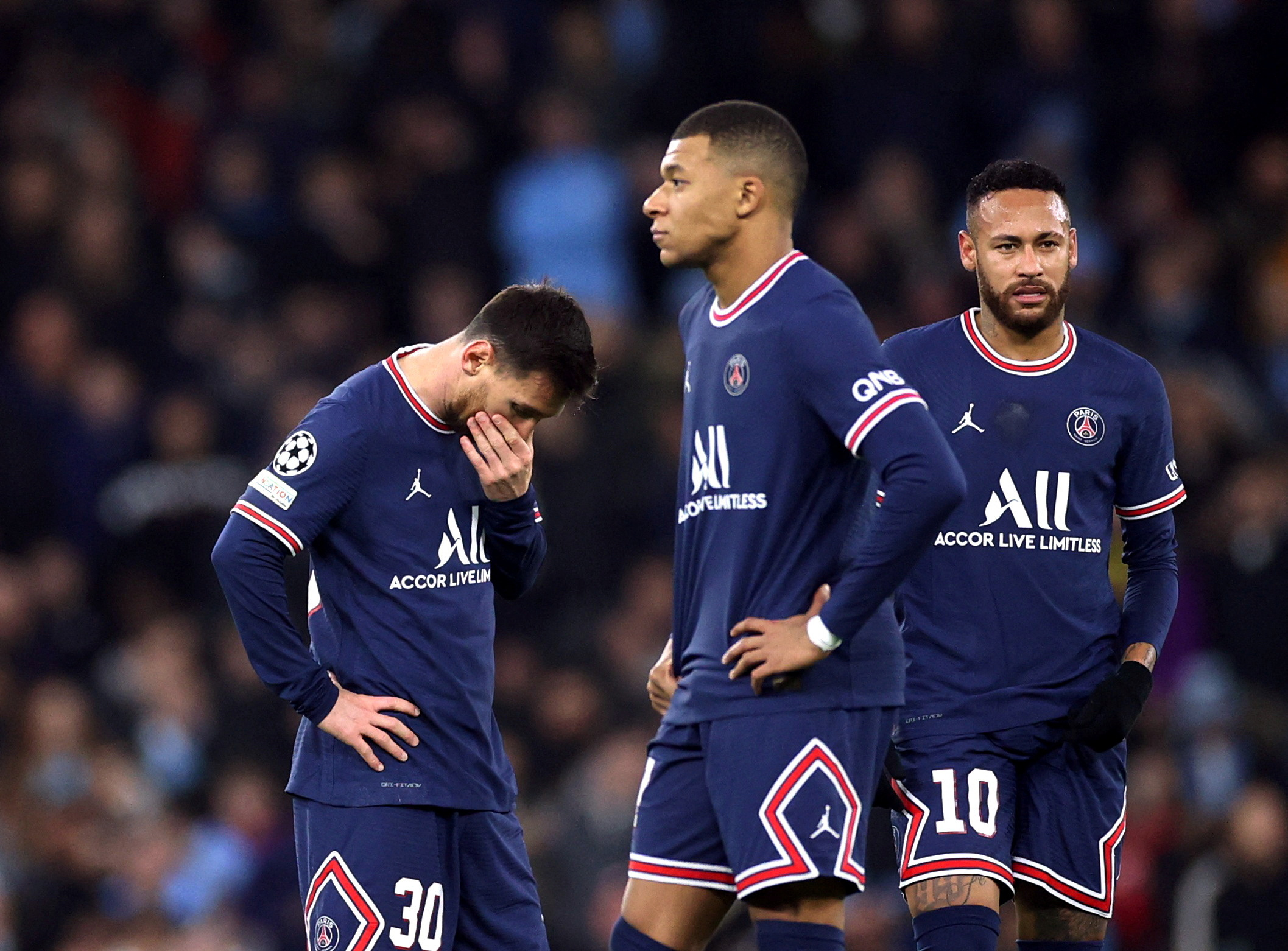 FILE PHOTO: Soccer Football - Champions League - Group A - Manchester City v Paris St Germain - Etihad Stadium, Manchester, Britain - November 24, 2021 Paris St Germain's Lionel Messi, Kylian Mbappe and Neymar looks dejected after Manchester City's Raheem Sterling scored their first goal Action images via Reuters