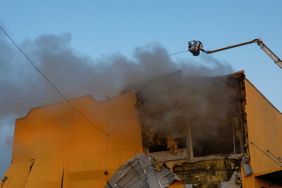Firefighters work at a site of a tobacco factory damaged during Russian suicide drone strike, amid Russia's attack on Ukraine, in Kyiv, Ukraine May 28, 2023. REUTERS