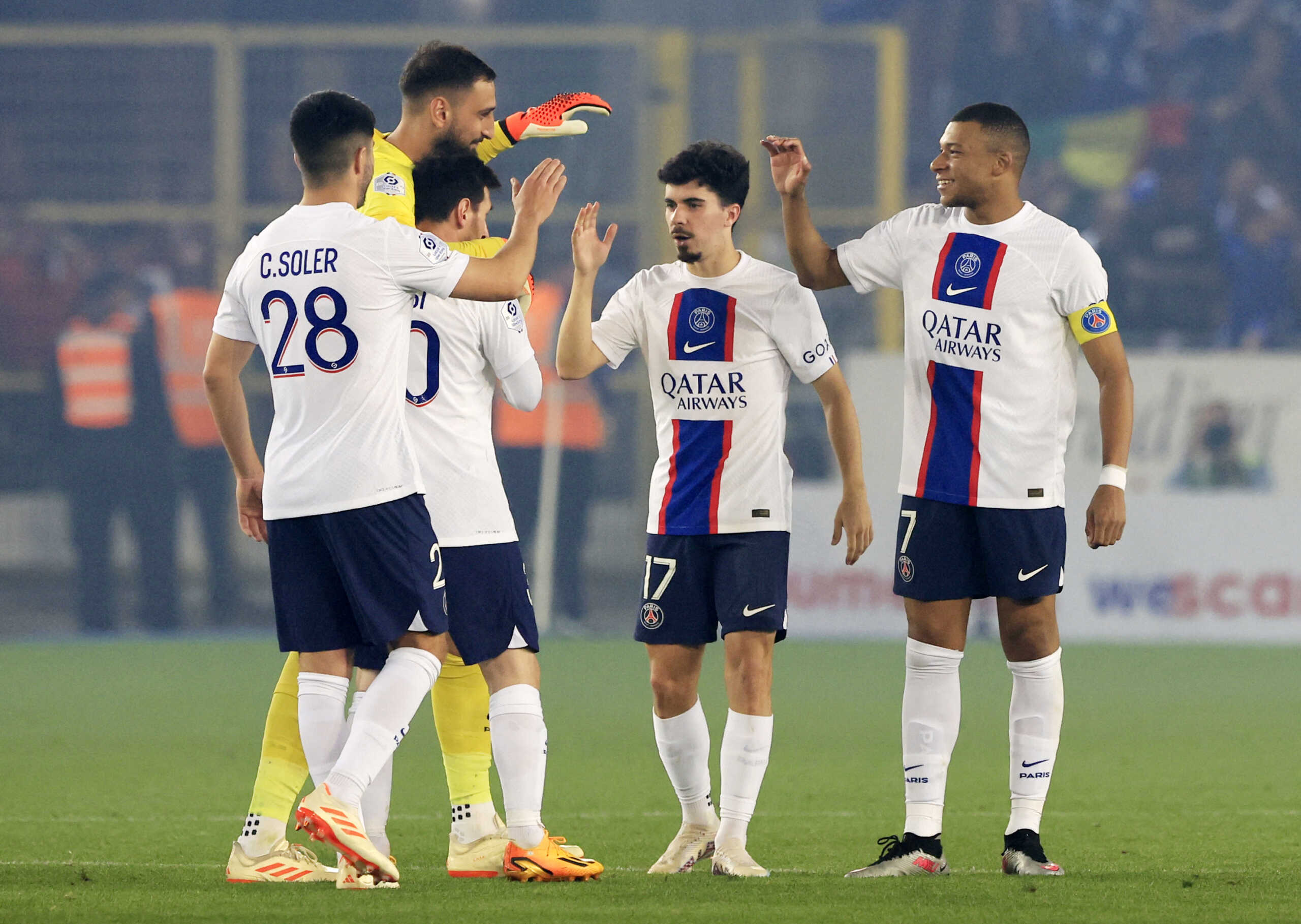 Soccer Football - Ligue 1 - RC Strasbourg v Paris St Germain - Stade de la Meinau, Strasbourg, France - May 27, 2023  Paris St Germain's Carlos Soler, Gianluigi Donnarumma, Vitinha, Lionel Messi and Kylian Mbappe celebrate after winning Ligue 1 REUTERS