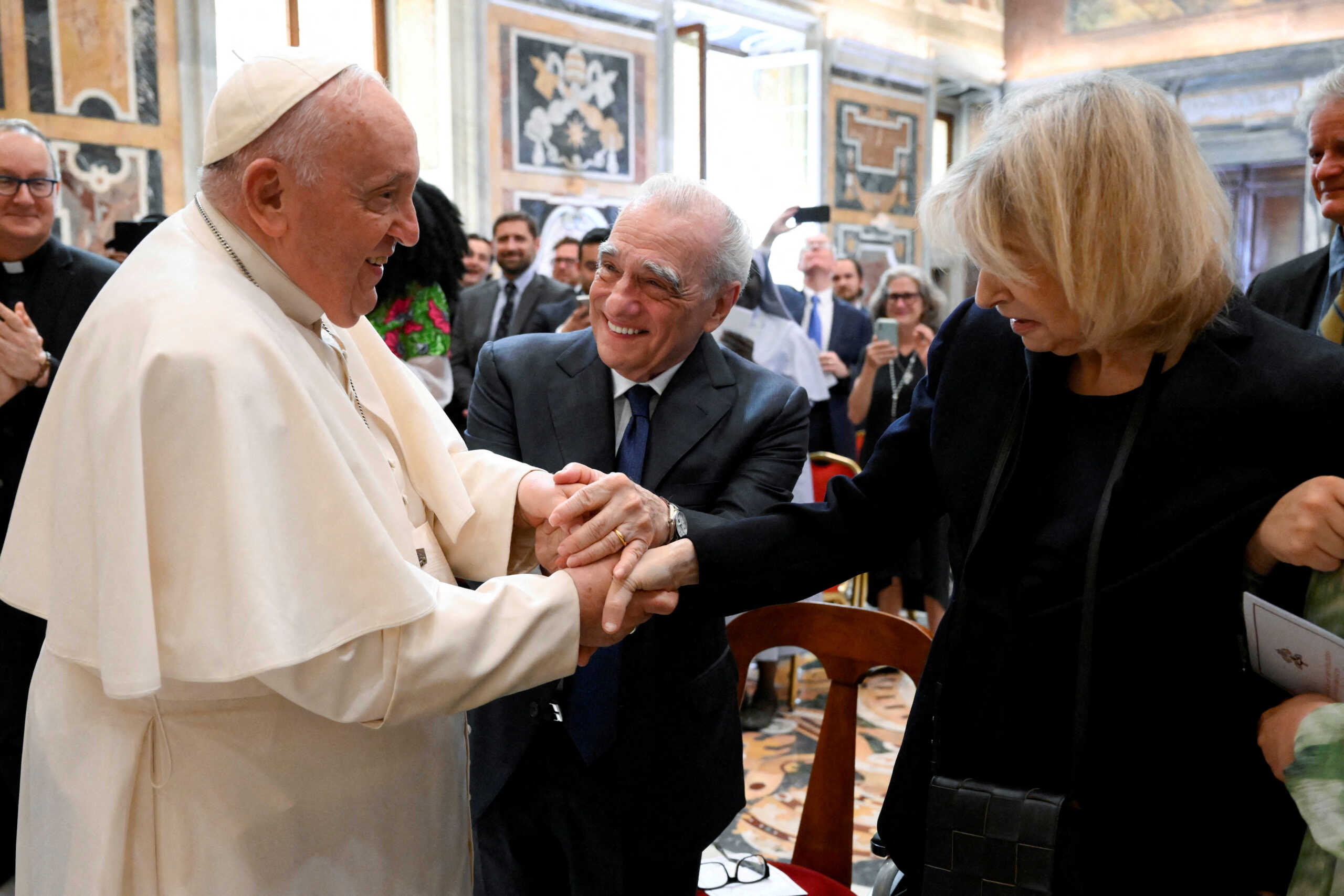 Pope Francis meets with director Martin Scorsese and his wife Helen Morris during a conference promoted by La Civilta Cattolica and Georgetown University at the Vatican, May 27, 2023.    Vatican Media