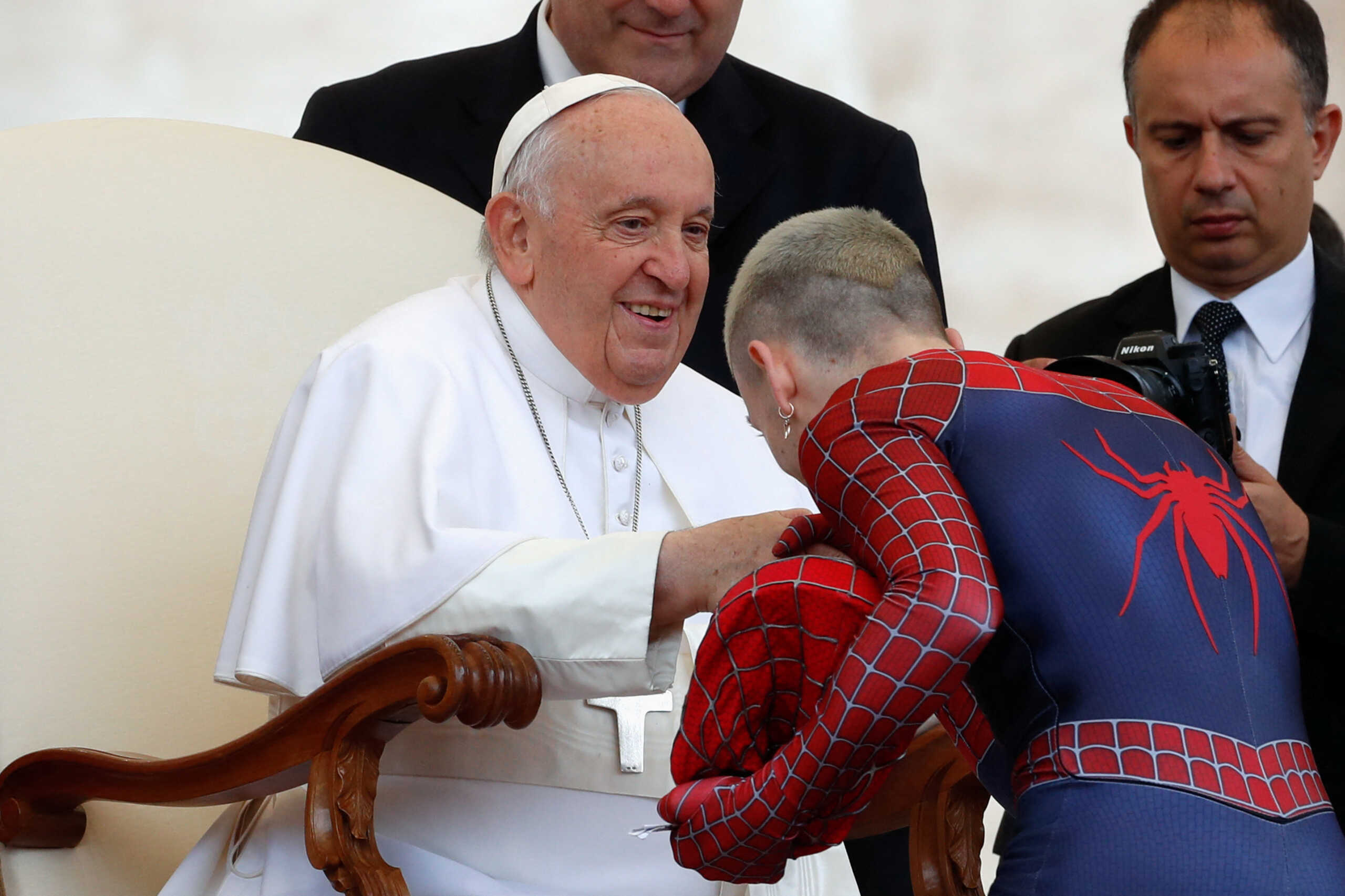 Pope Francis meets a man wearing a Spiderman costume during the weekly general audience in St. Peter's Square at the Vatican, May 10, 2023. REUTERS