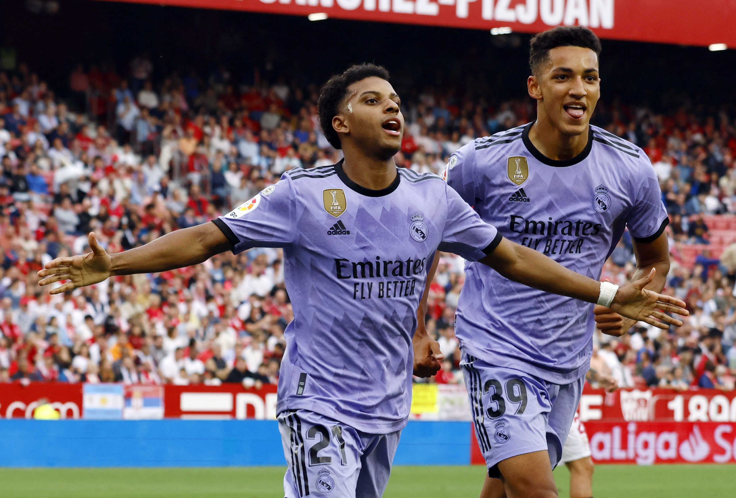 Soccer Football - LaLiga - Sevilla v Real Madrid - Ramon Sanchez Pizjuan, Seville, Spain - May 27, 2023 Real Madrid's Rodrygo celebrates scoring their second goal with Alvaro Rodriguez REUTERS