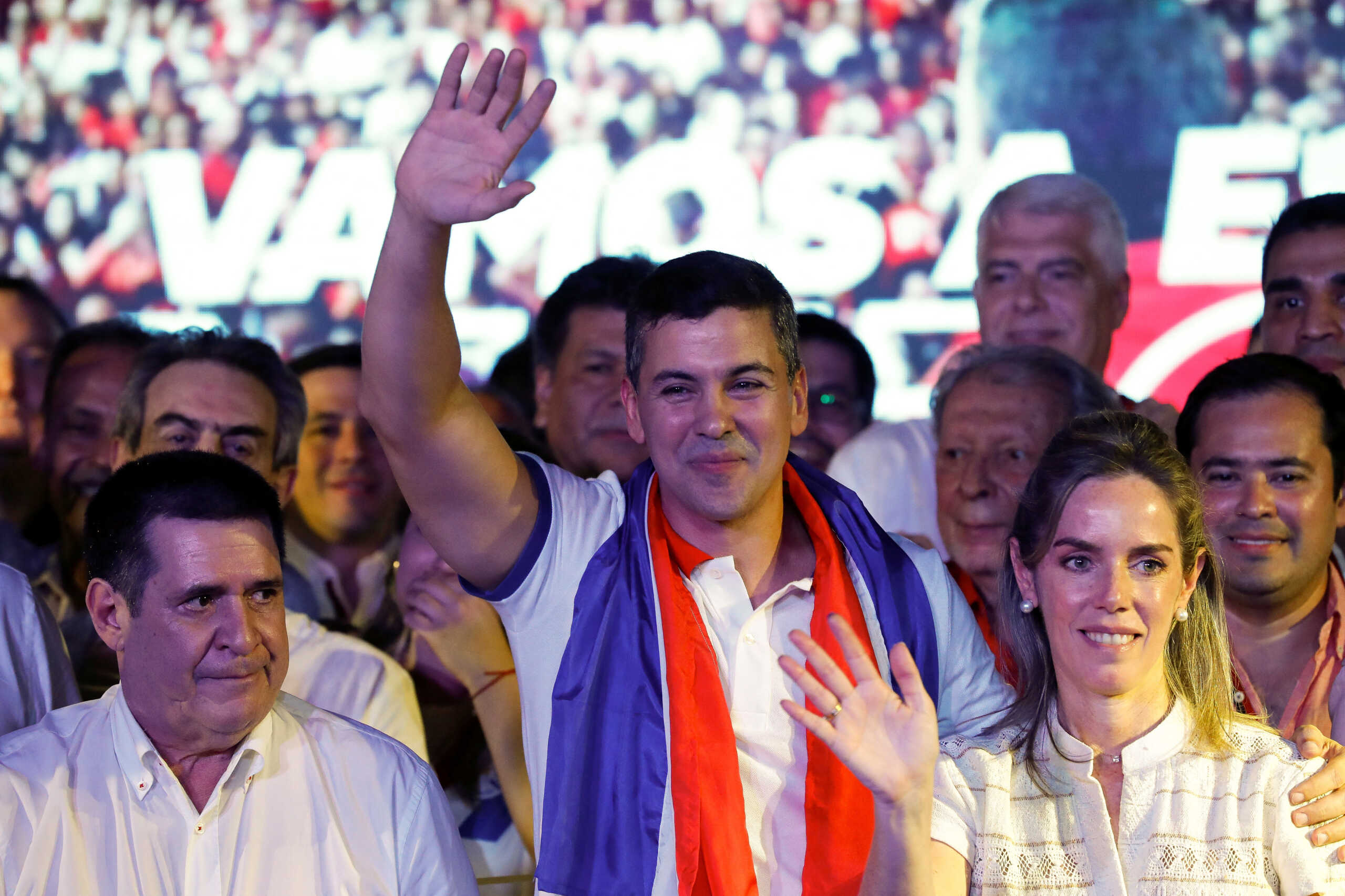 Paraguayan presidential candidate Santiago Pena from the ruling Colorado Party celebrates next to his wife Leticia Ocampos at the party headquarters as he and his running mate Pedro Alliana won Paraguay's presidential race, according to the preliminary official count, in Asuncion, Paraguay April 30, 2023. REUTERS