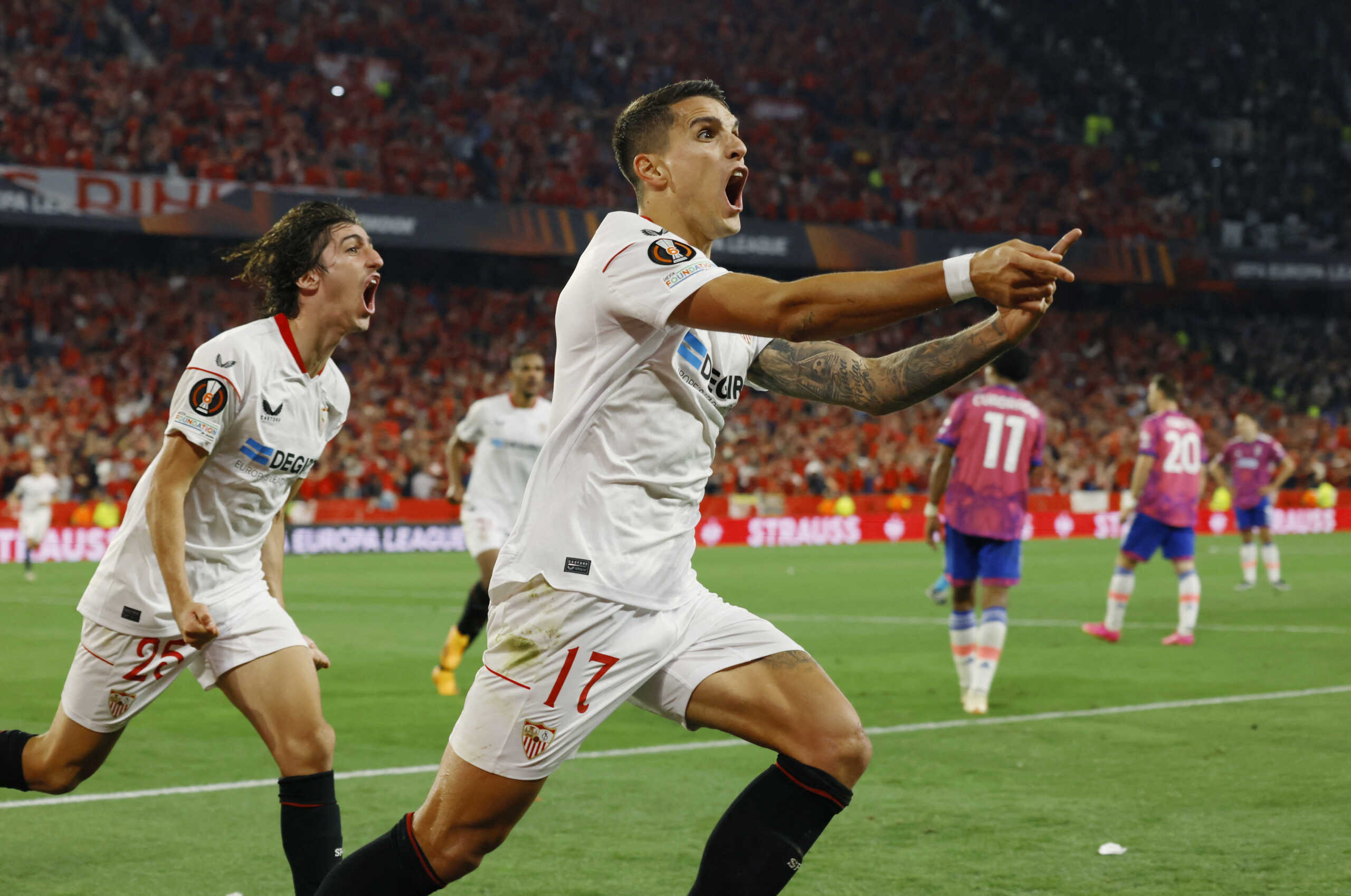 Soccer Football -  Europa League - Semi Final - Second Leg - Sevilla v Juventus - Ramon Sanchez Pizjuan, Seville, Spain - May 18, 2023  Sevilla's Erik Lamela celebrates scoring their second goal with Bryan Gil REUTERS