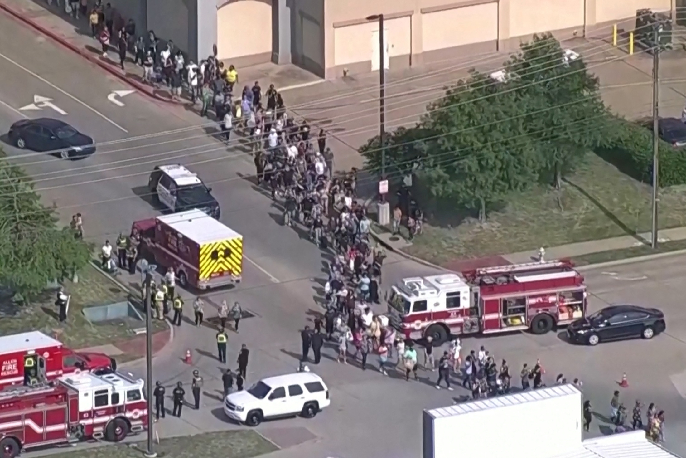 Shoppers leave as law enforcement officers respond to a shooting in the Dallas area's Allen Premium Outlets, which authorities said has left multiple people injured in Allen, Texas, U.S. May 6, 2023 in a still image from video.  ABC Affiliate WFAA via REUTERS     NO RESALES. NO ARCHIVES. MANDATORY CREDIT