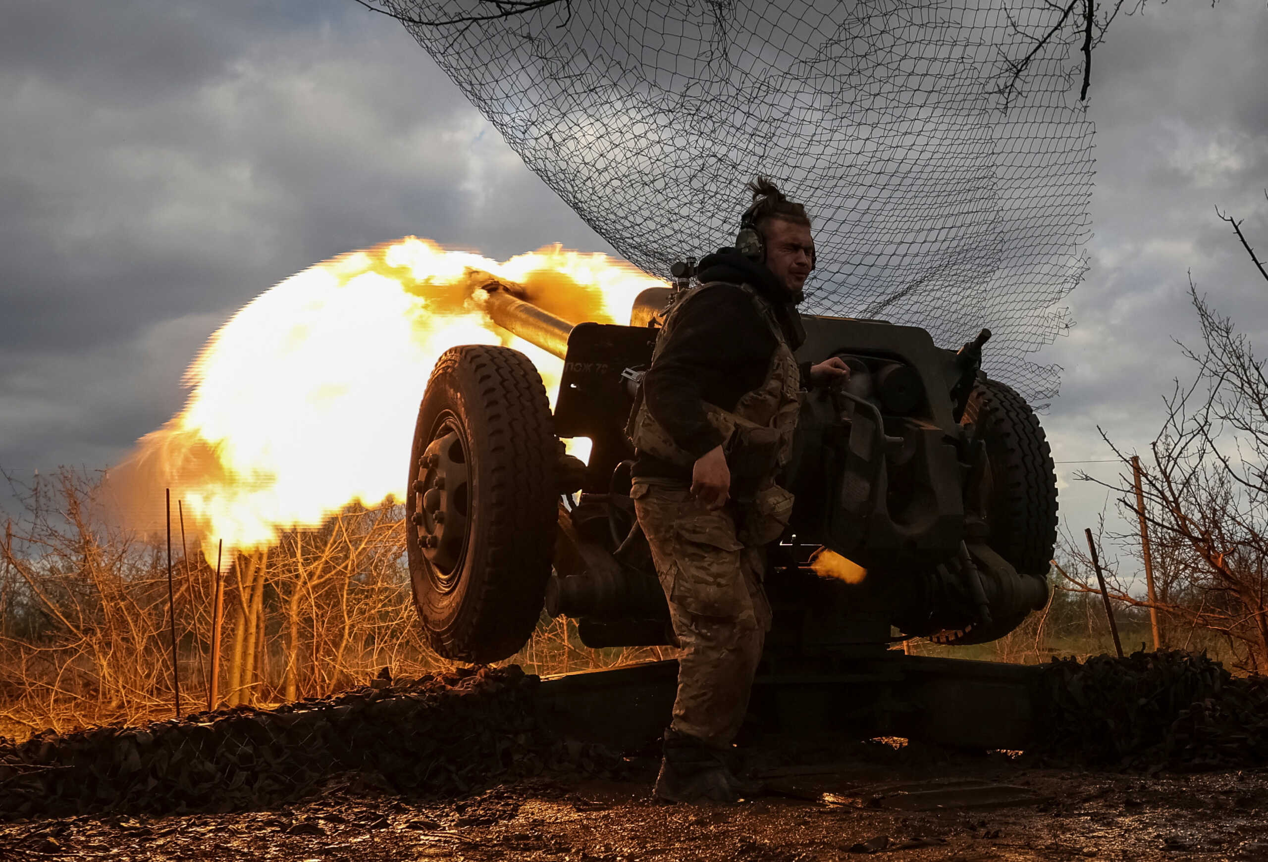 Ukrainian service members from a 3rd separate assault brigade of the Armed Forces of Ukraine, fire a howitzer D30 at a front line, amid Russia's attack on Ukraine, near the city of Bakhmut, Ukraine April 23, 2023. REUTERS