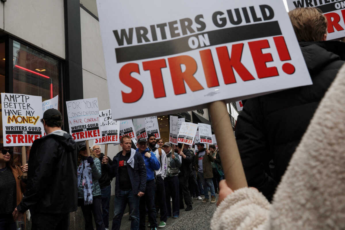 Members of the Writers Guild of America (WGA) East picket outside Peacock Newfront streaming service offices, in New York City, U.S., May 2, 2023.  REUTERS