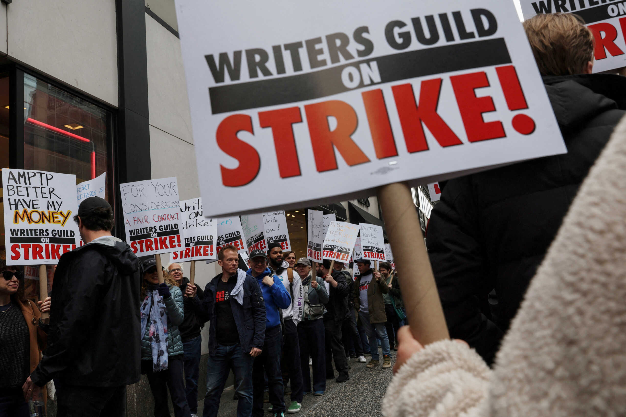 Members of the Writers Guild of America (WGA) East picket outside Peacock Newfront streaming service offices, in New York City, U.S., May 2, 2023.  REUTERS