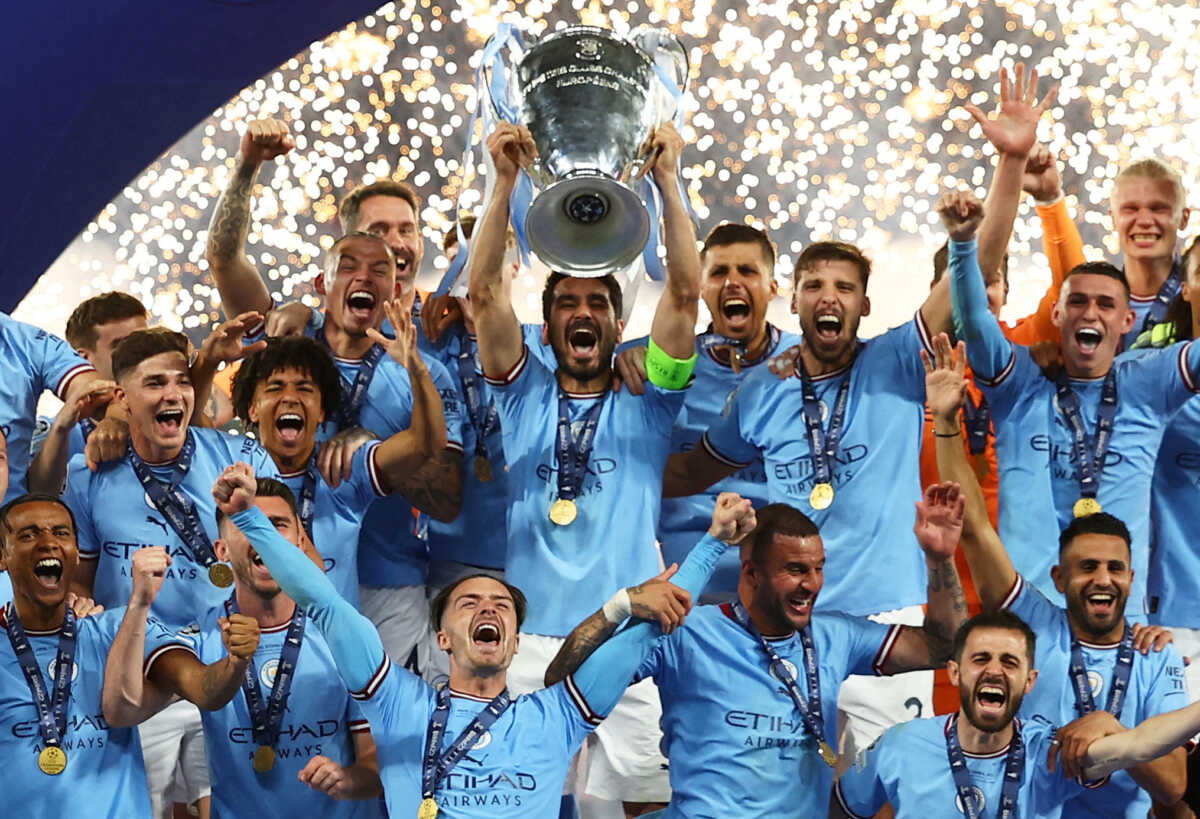 Soccer Football - Champions League Final - Manchester City v Inter Milan - Ataturk Olympic Stadium, Istanbul, Turkey - June 11, 2023 Manchester City's Ilkay Gundogan lifts the trophy as he celebrates with teammates after winning the Champions League REUTERS
