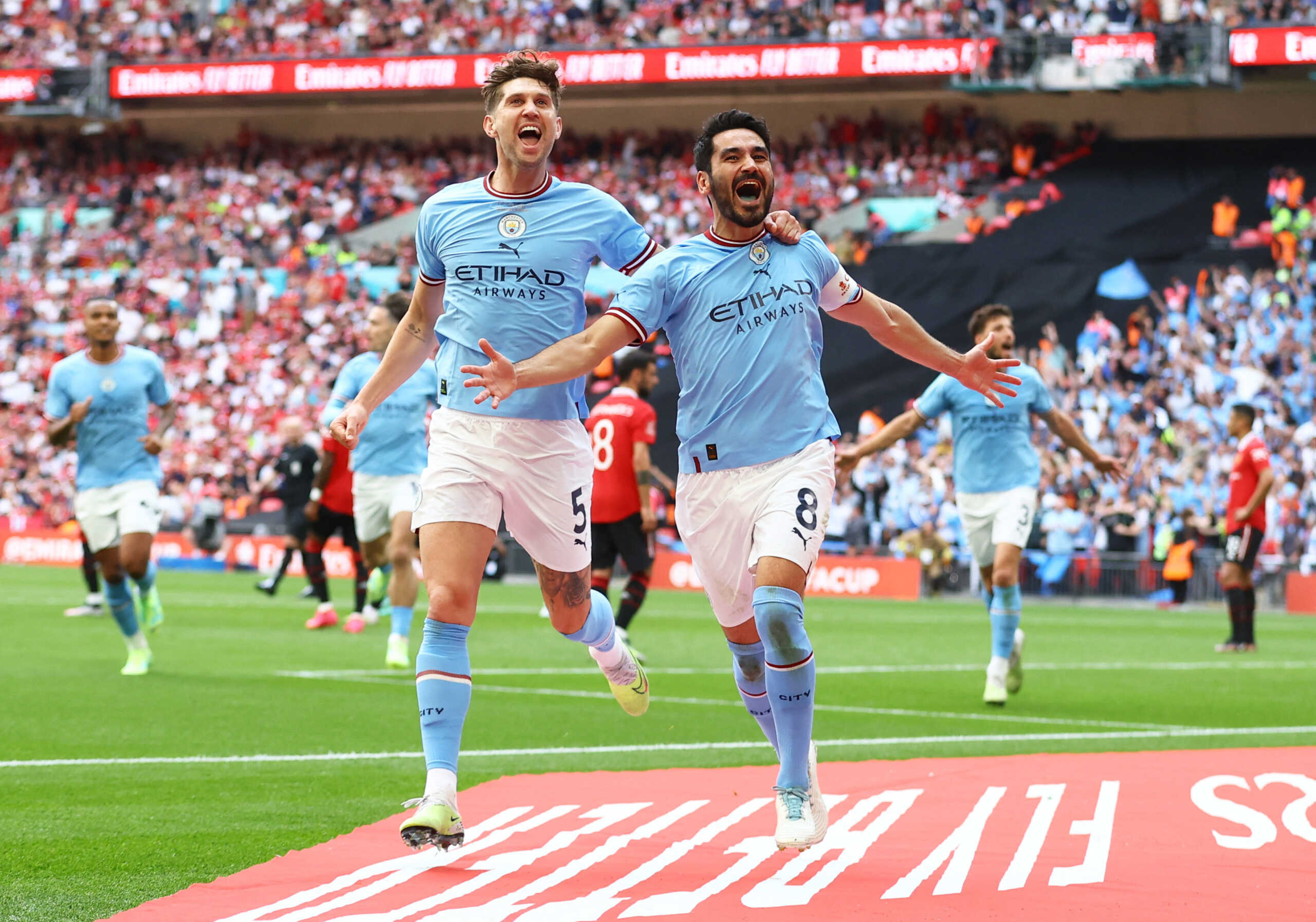 Soccer Football - FA Cup Final - Manchester City v Manchester United - Wembley Stadium, London, Britain - June 3, 2023 Manchester City's Ilkay Gundogan celebrates scoring their second goal with John Stones REUTERS