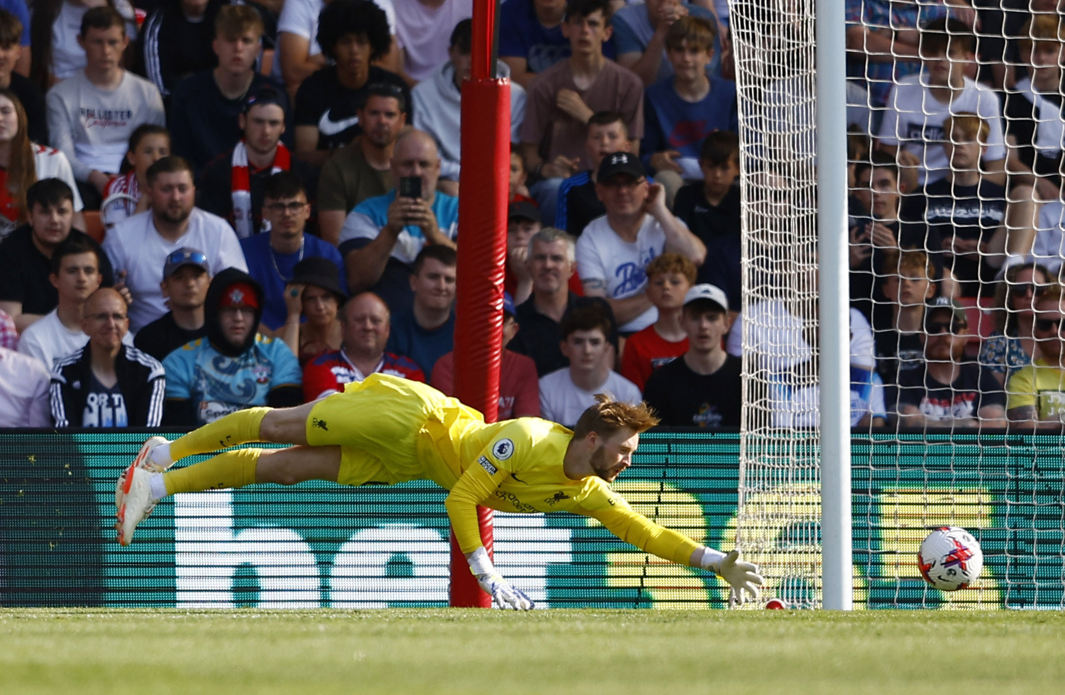 Soccer Football - Premier League - Southampton v Liverpool - St Mary's Stadium, Southampton, Britain - May 28, 2023  Southampton's Adam Armstrong scores their fourth goal past Liverpool's Caoimhin Kelleher REUTERS