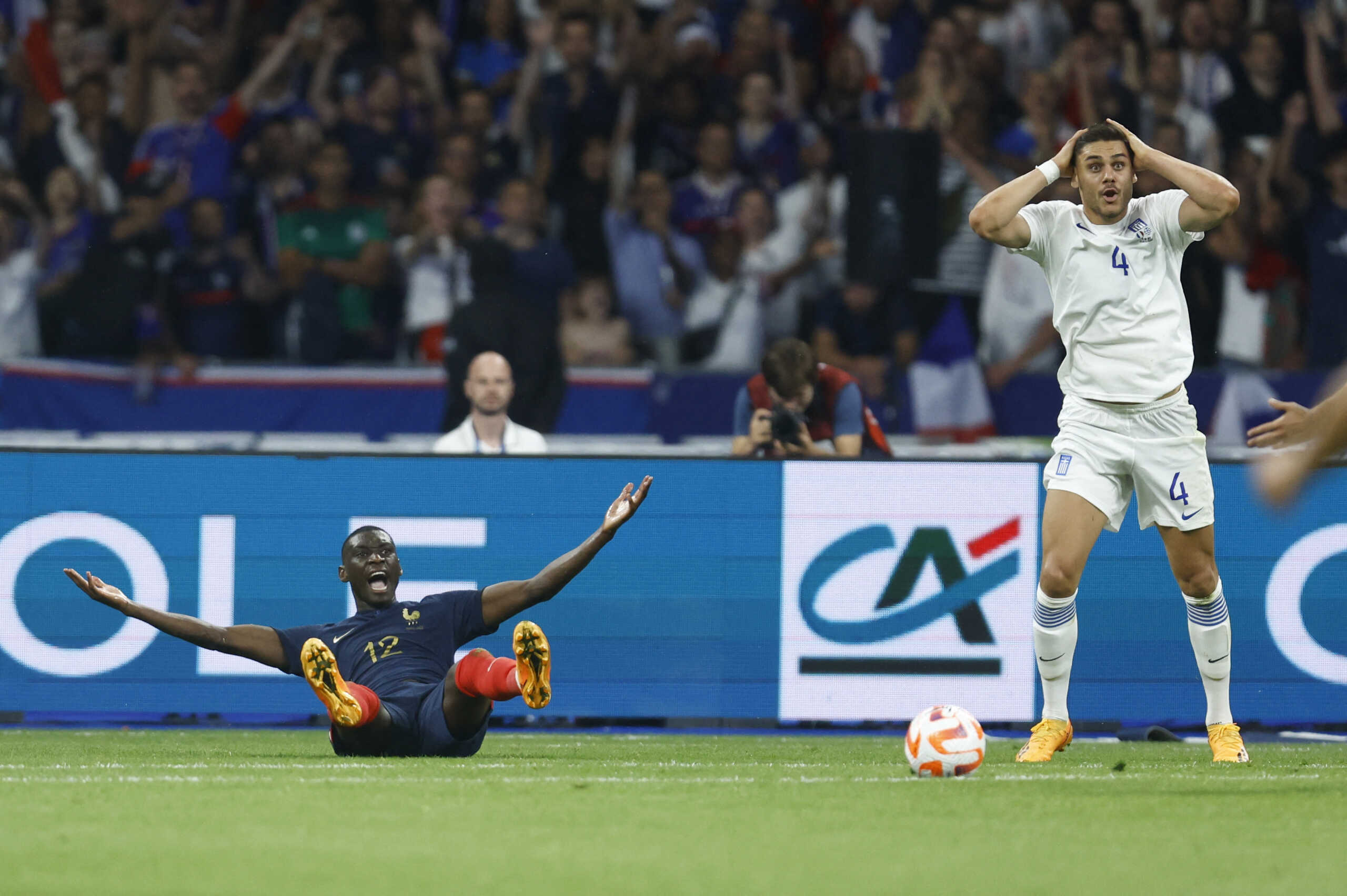 Soccer Football - UEFA Euro 2024 Qualifier - Group B - France v Greece - Stade de France, Saint-Denis, France - June 19, 2023 France's Randal Kolo Muani reacts as Greece's Dinos Mavropanos is shown a red card by referee Antonio Mateu Lahoz REUTERS