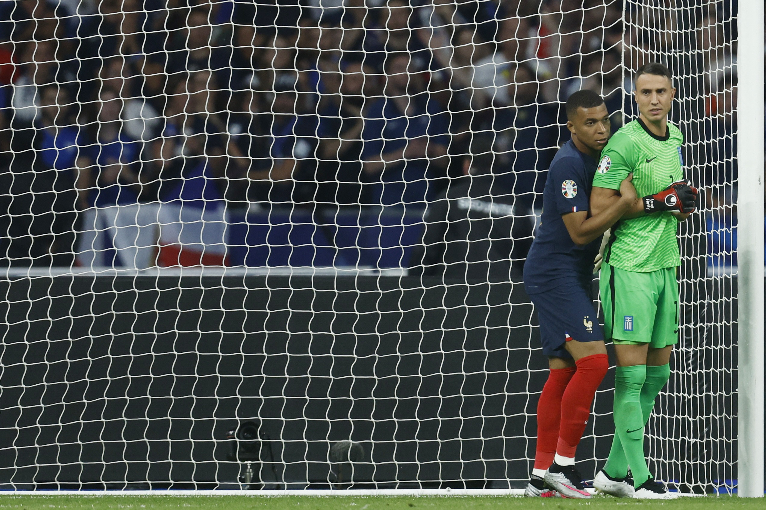 Soccer Football - UEFA Euro 2024 Qualifier - Group B - France v Greece - Stade de France, Saint-Denis, France - June 19, 2023 France's Kylian Mbappe with Greece's Odysseas Vlachodimos REUTERS