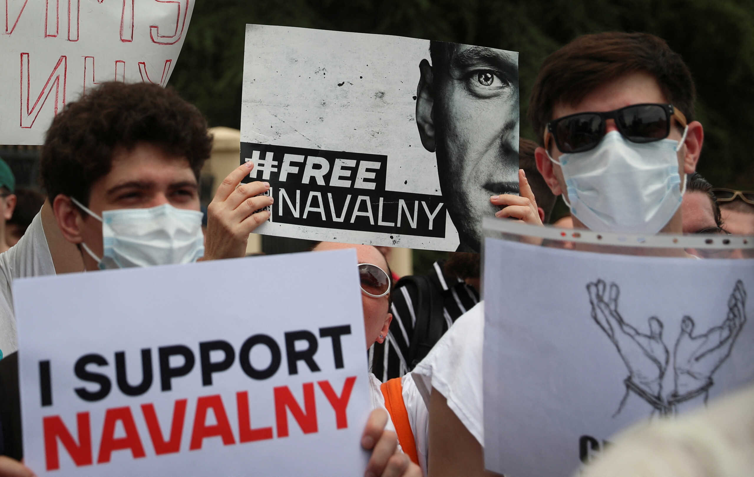Activists hold a rally in support of jailed Russian opposition politician Alexei Navalny in front of the building of Russian Federation Interests Section of the Embassy of Switzerland, in Tbilisi, Georgia June 4, 2023.  REUTERS