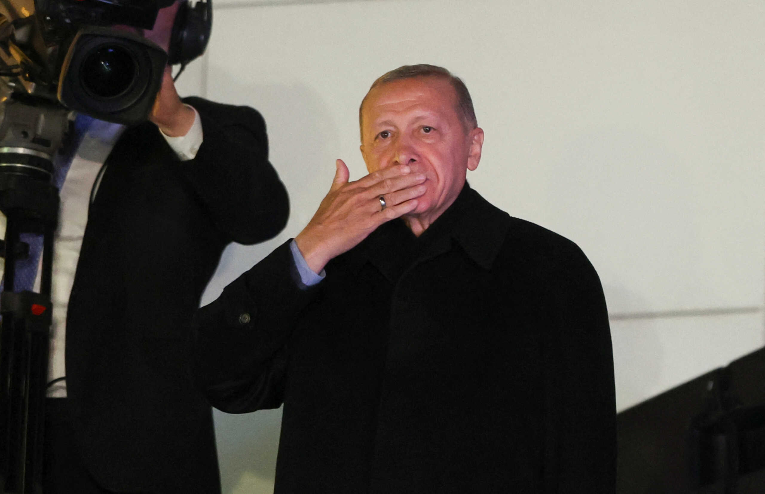 Turkish President Recep Tayyip Erdogan greets supporters at the AK Party headquarters in Ankara, Turkey May 15, 2023. REUTERS