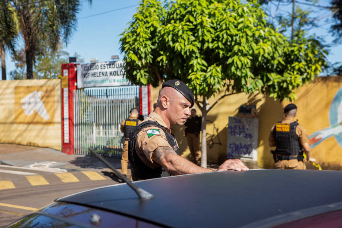 Military police officers stand in front of the Professora Helena Kolody public school where at least one student has died after a school shooting in Cambe, Parana state, Brazil June 19, 2023. REUTERS