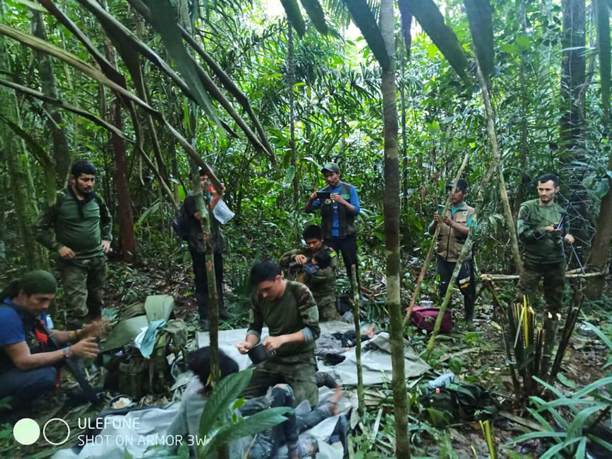 Colombian military soldiers attend to child survivors from a Cessna 206 plane that crashed in the jungles of Caqueta, in limits between Caqueta and Guaviare, June 9, 2023. Colombian Military Forces