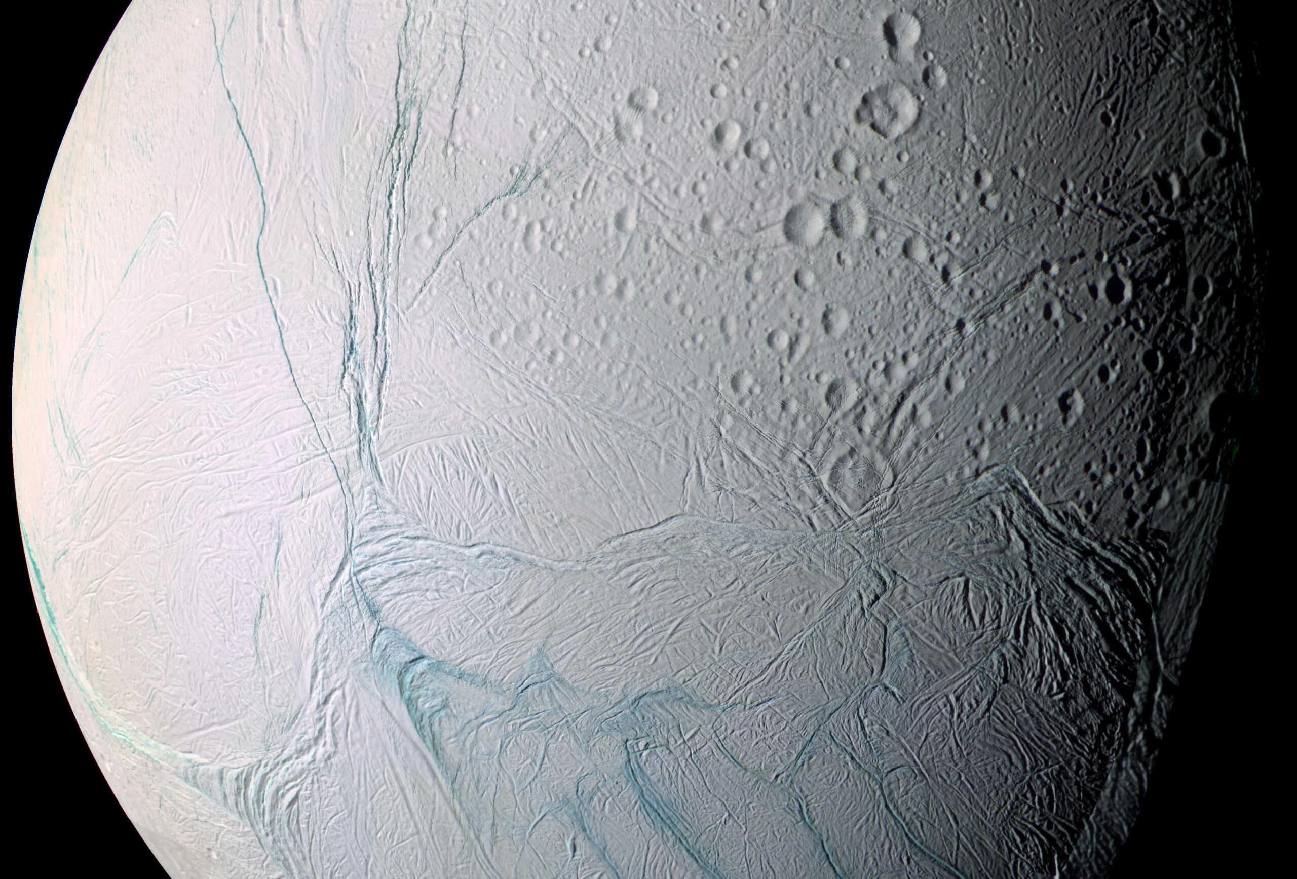 A mosaic image of Saturn's moon Enceladus, composed from high-resolution pictures captured by NASA's Cassini spacecraft during a 2005 flyby, shows the long fissures in the moon?s icy crust at its south pole that allows water from the subsurface ocean to spew into space.   NASA