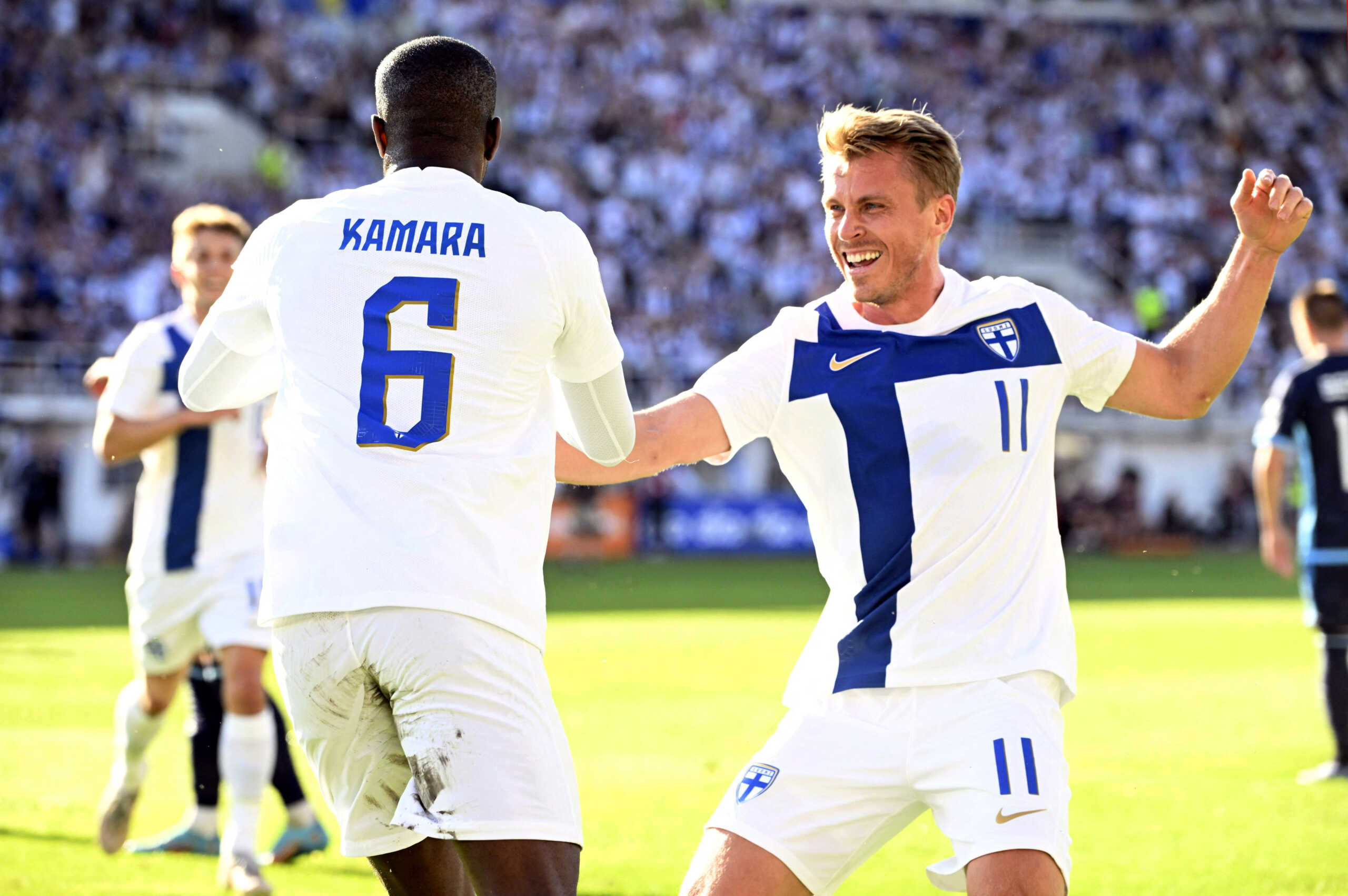 Soccer Football - UEFA Euro 2024 Qualifier - Group D - Finland v San Marino - Helsinki Olympic Stadium, Helsinki, Finland - June 19, 2023  Glen Kamara of Finland celebrates scoring their first goal with Rasmus Schuller  Jussi Nukari