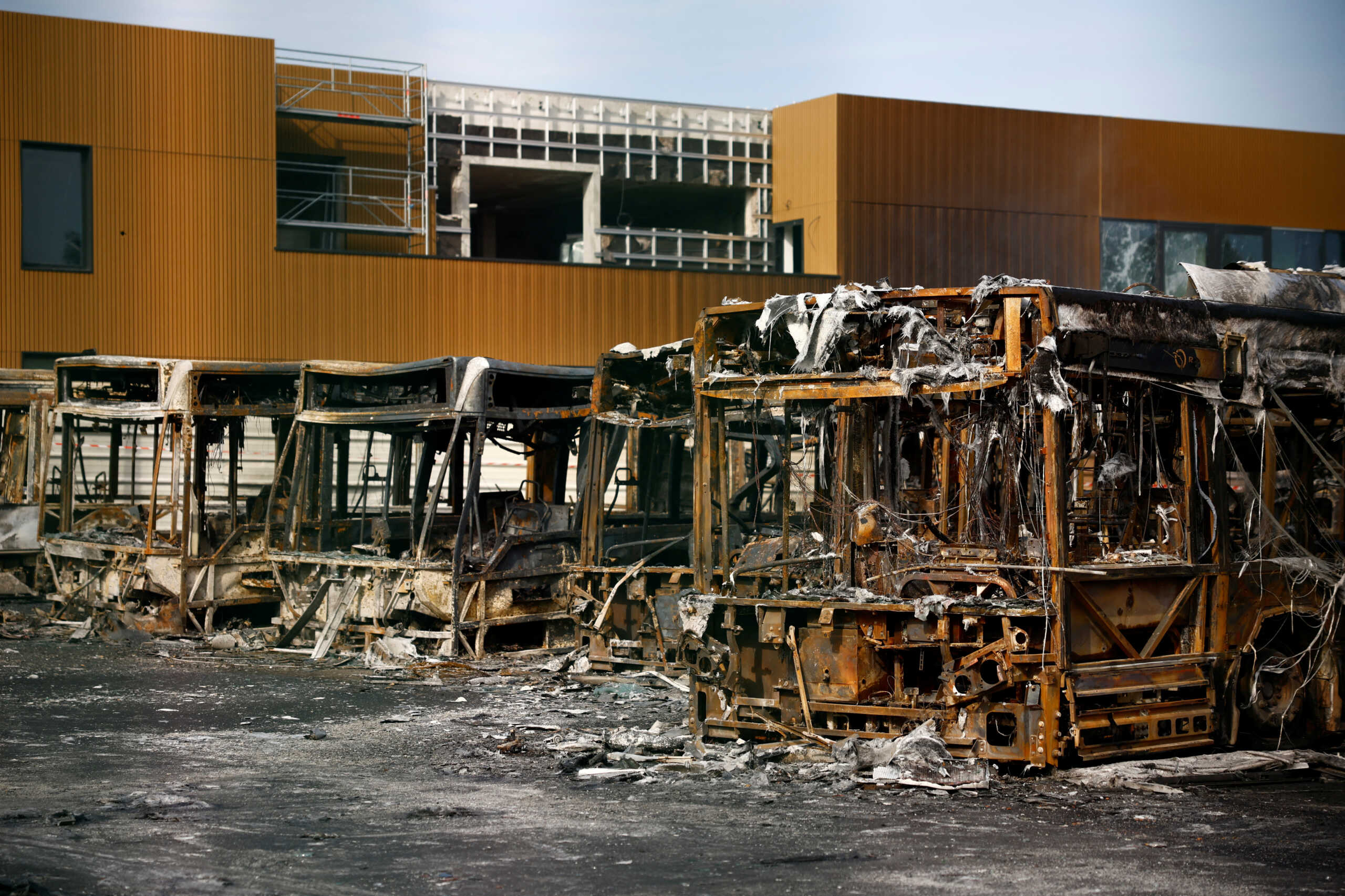 View of burnt buses at a RATP bus depot damaged during night clashes between protesters and police, following the death of Nahel, a 17-year-old teenager killed by a French police officer in Nanterre during a traffic stop, in Aubervilliers, near Paris, France, June 30, 2023. REUTERS