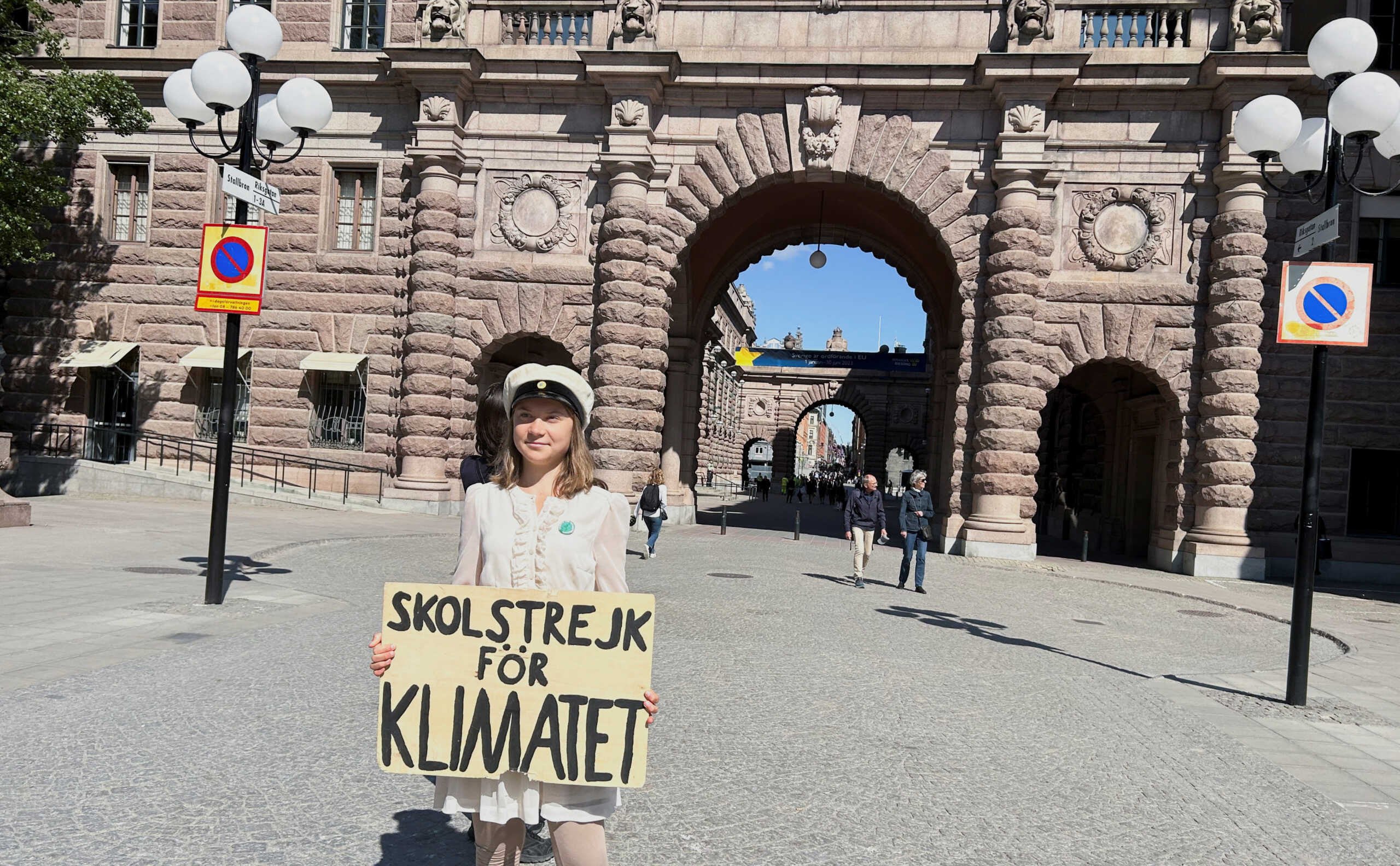 Greta Thunberg stands with a sign that reads, "School Strike for climate", outside the Swedish Parliament on the day of her weekly protest in Stockholm, Sweden, June 9, 2023. REUTERS