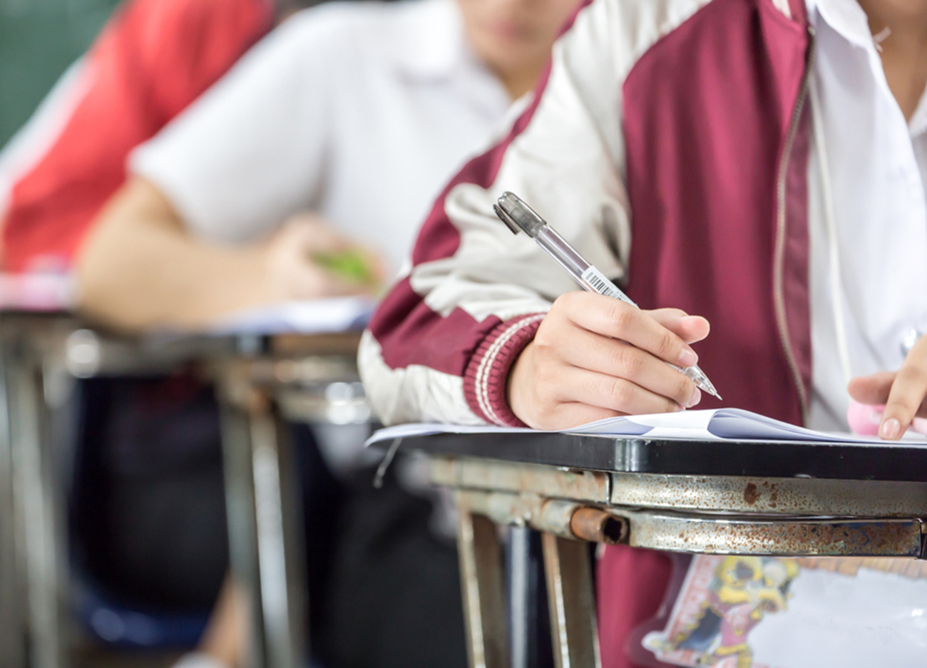 high school or college student writing in lecture class.examiner testing in examination room.concept for scholarship to study abroad.world international education learning,research for new knowledge