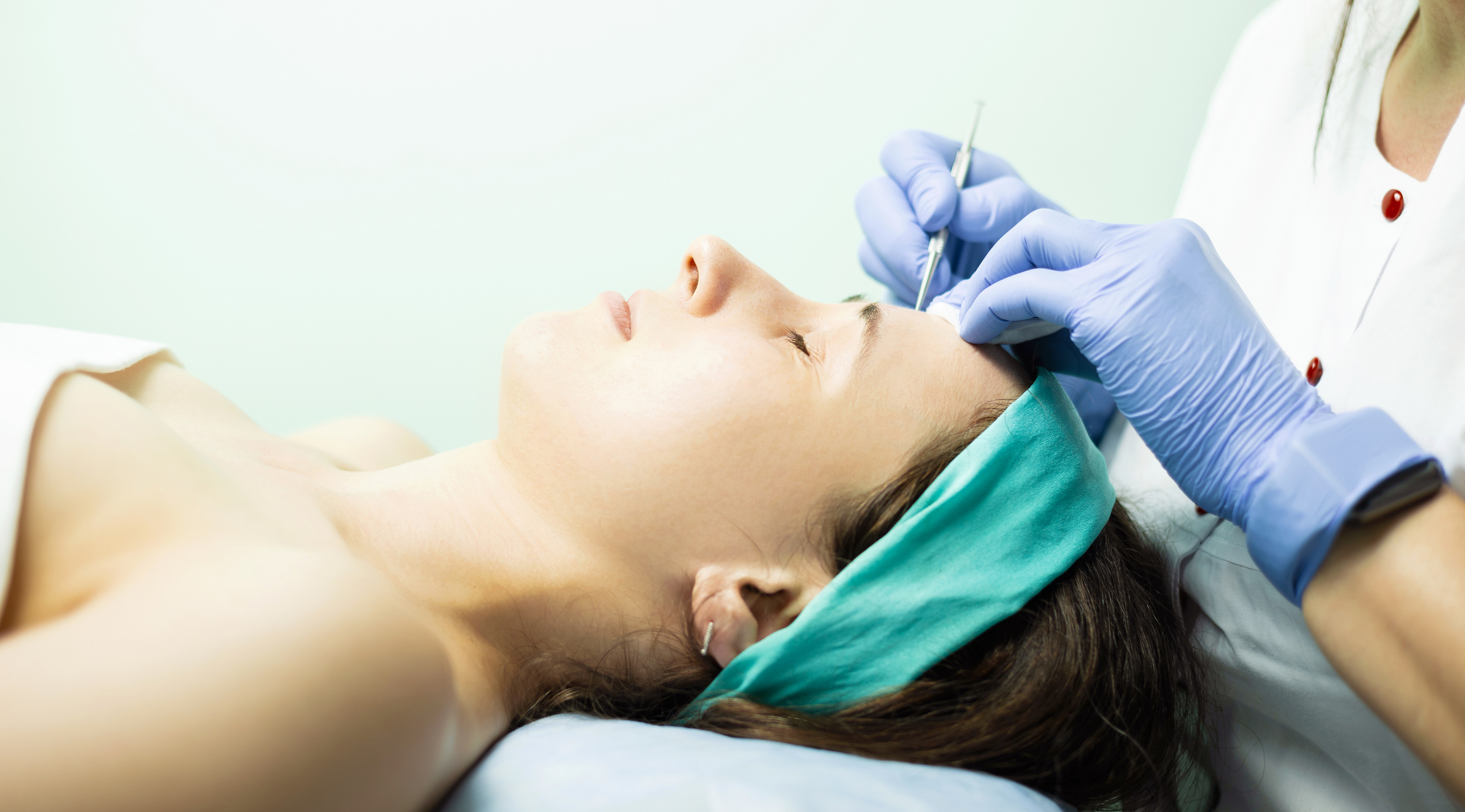 Photo of woman cleaning face from black dots, health and beauty concept.