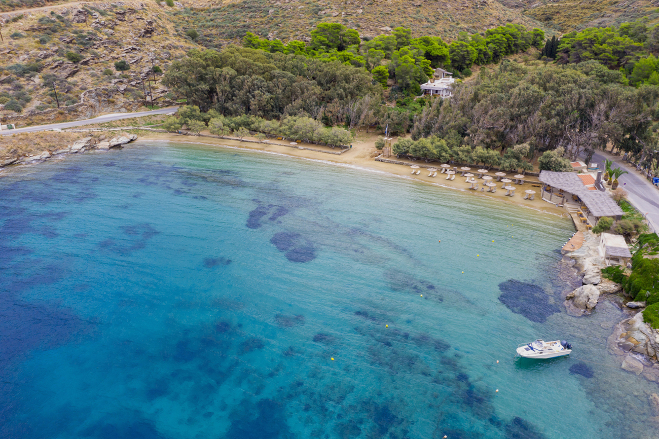 Kea Tzia island, Cyclades, Greece. Gialiskari bay and beach aerial drone view. Sailing boats anchored, calm sea water background