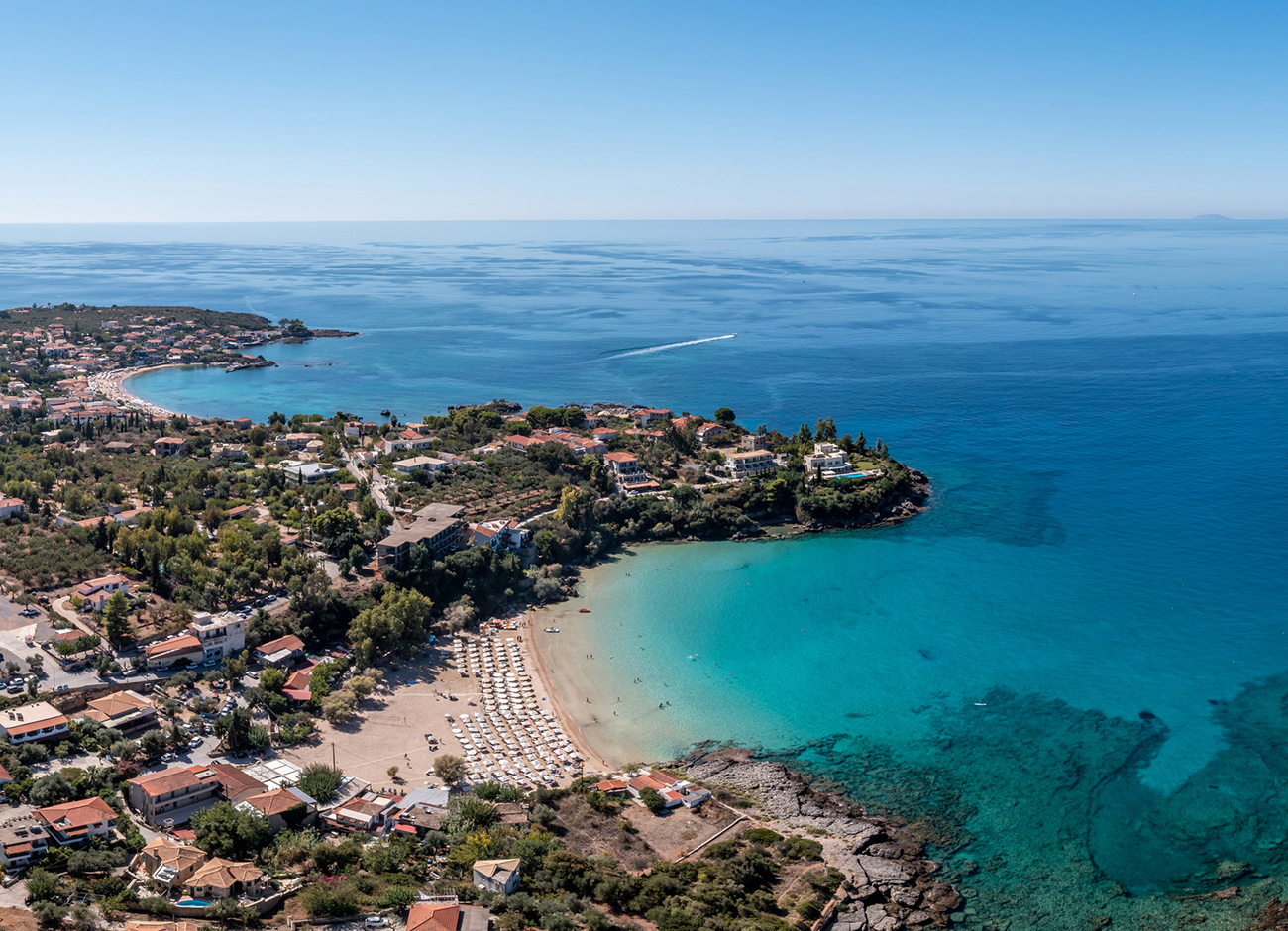 Greece Peloponnese. Stoupa traditional seaside village and sandy beach, aerial drone view. Coastline and water bay Mani, Messenia, summer destination