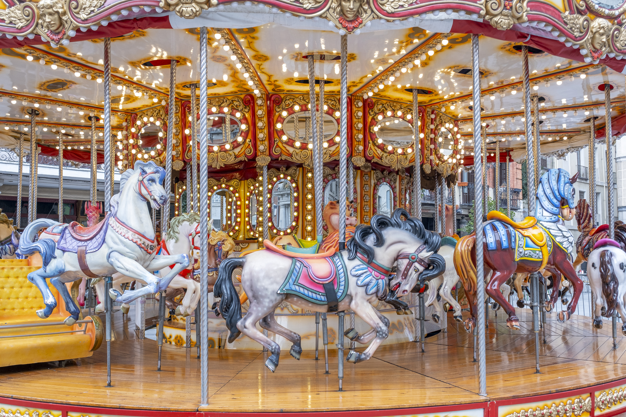 Horse carousel attraction at the fair on festival days
