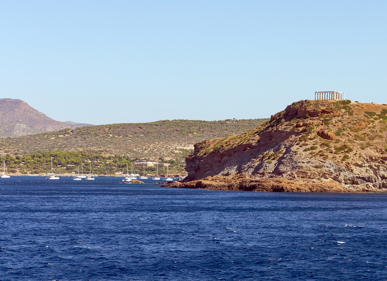 View of cape Sounio and the ancient temple of Poseidon, Attica, Greece.