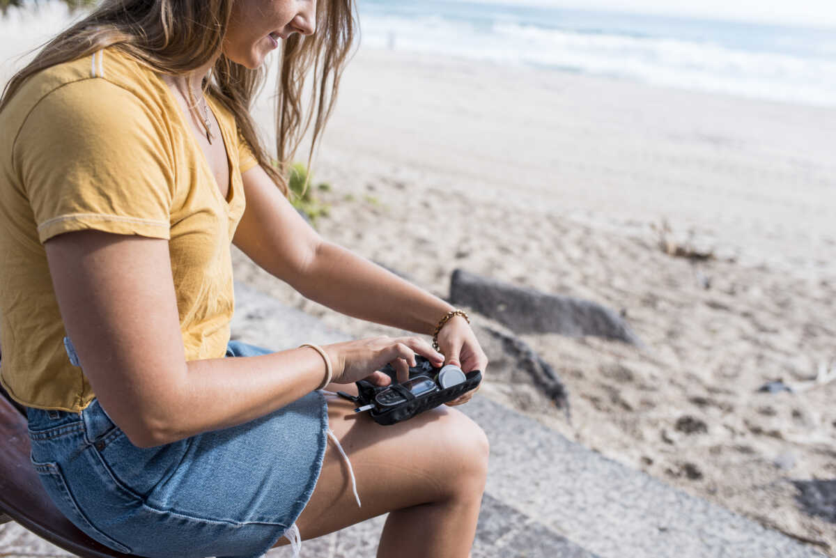 Young diabetic woman checking her blood glucose