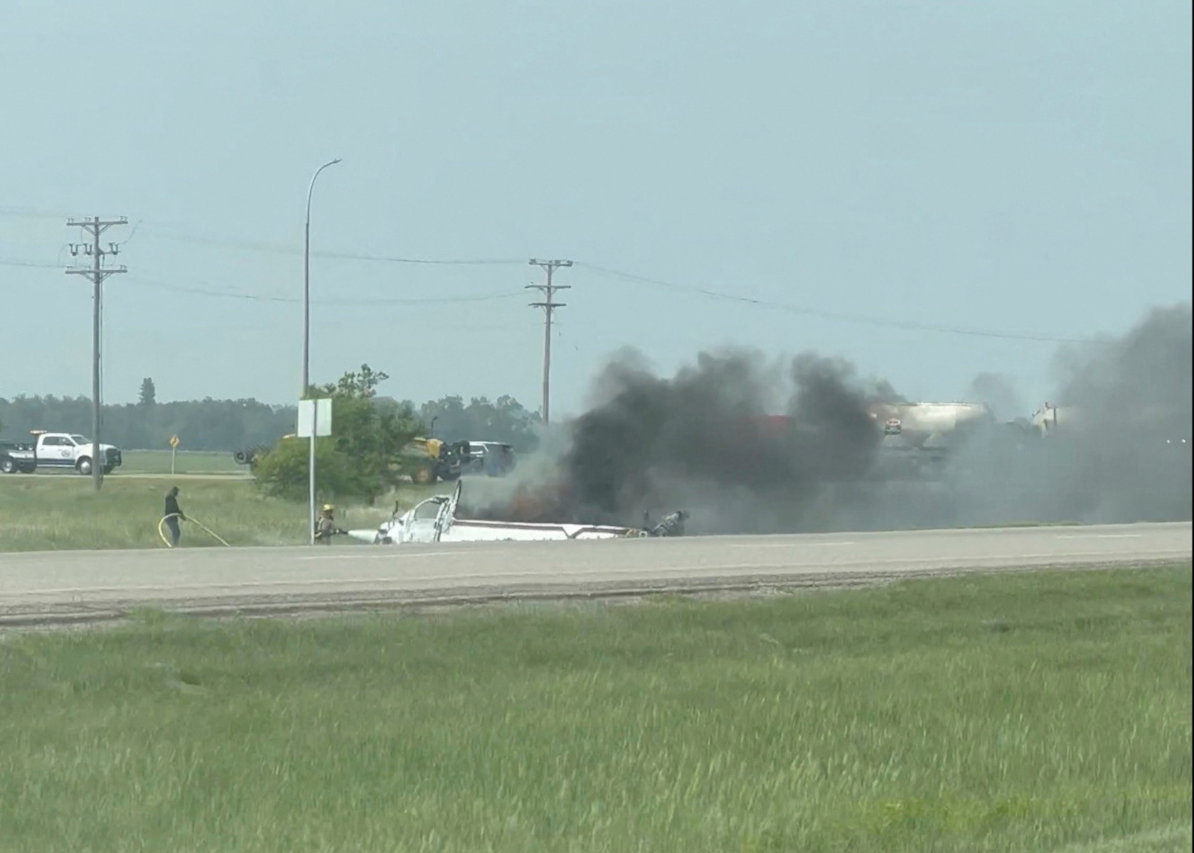 A view shows the area of a crash near Carberry, Manitoba, Canada June 15, 2023 in this still image obtained from a video. Leighton and Genevieve Hardinge