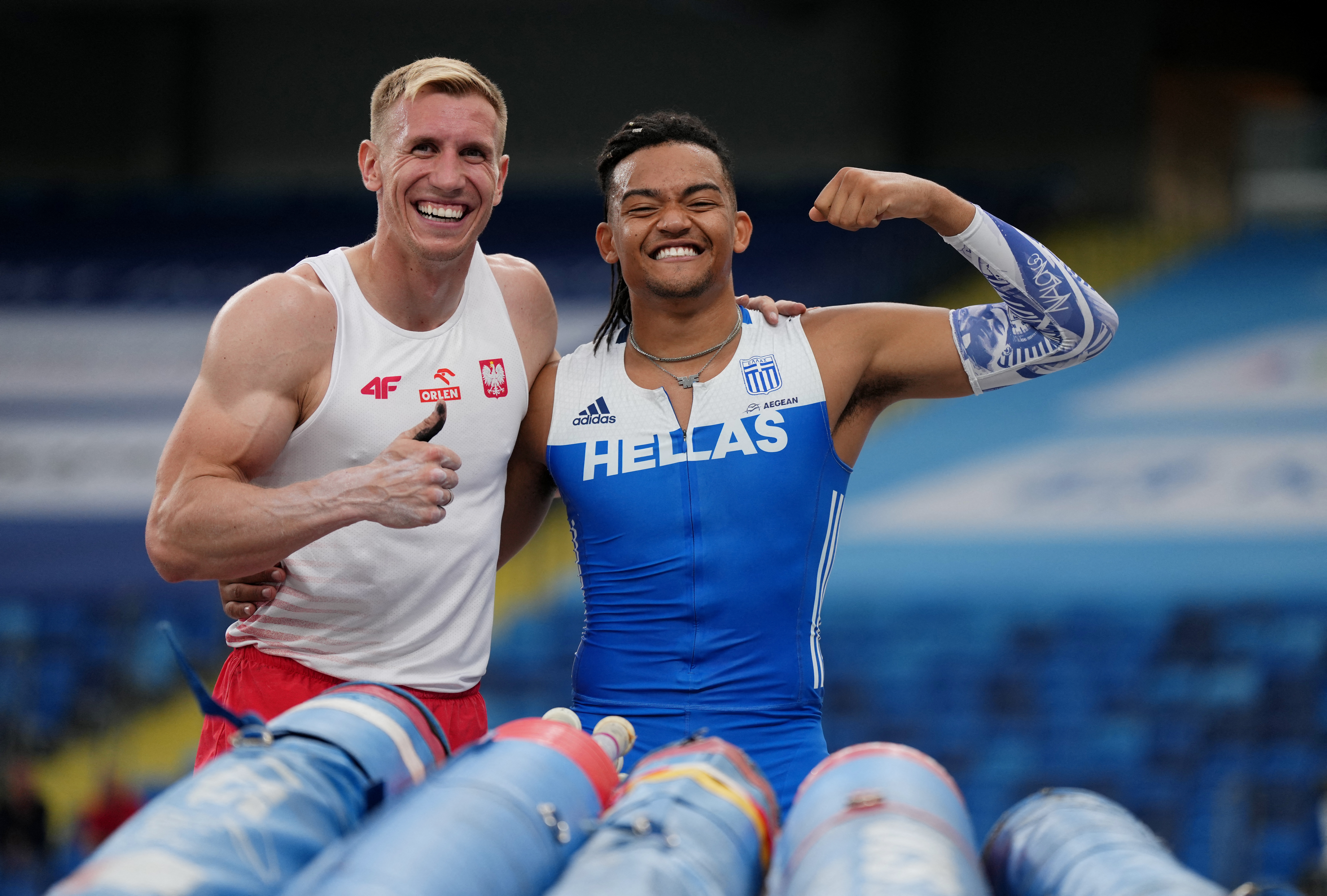 European Games - Athletics - Silesian Stadium, Chorzow, Poland - June 23, 2023 Greece's Emmanouil Karalis and Poland's Piotr Lisek pose for a picture during the Men's Pole Vault, Division 1 REUTERS