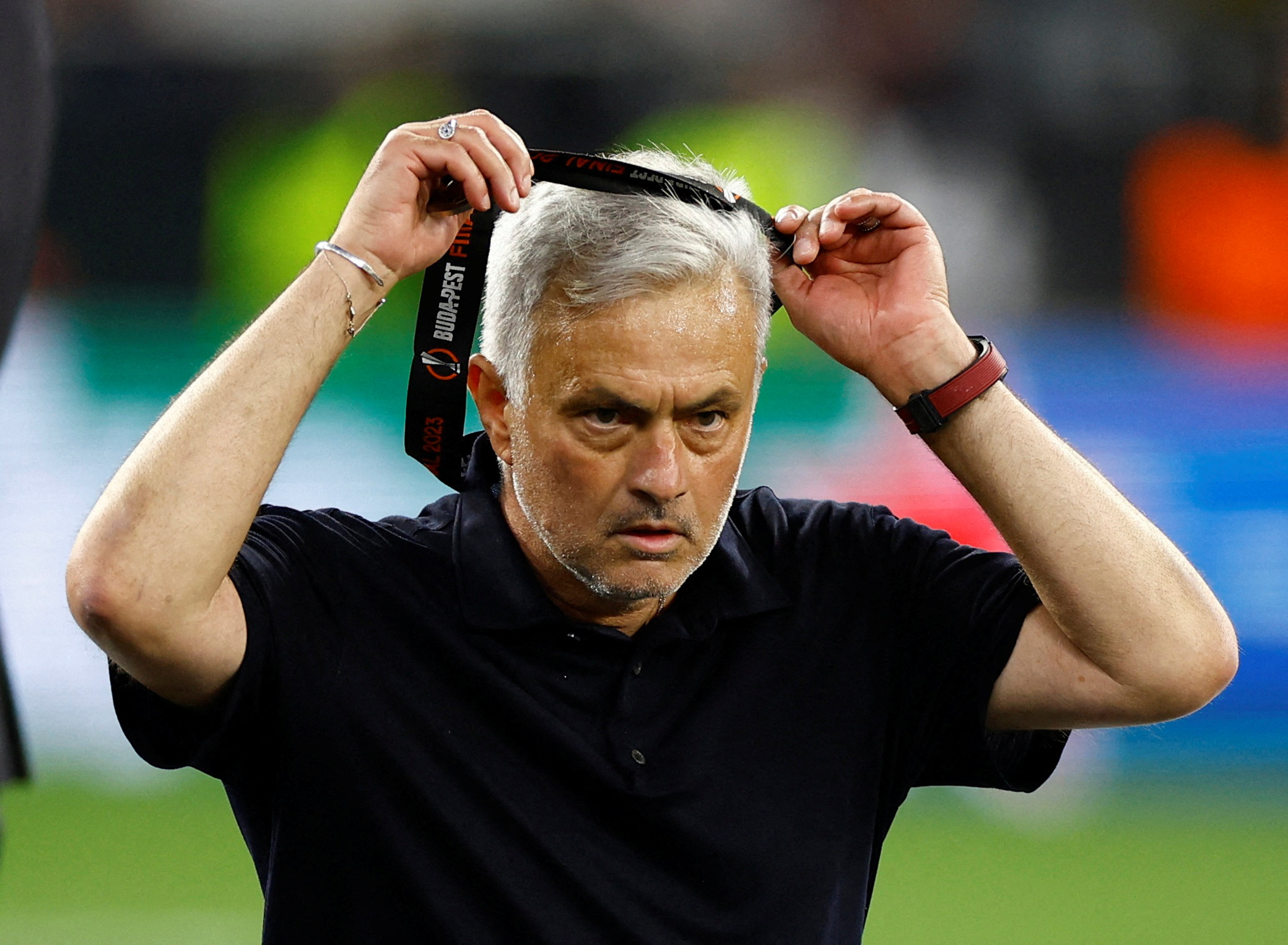 Soccer Football - Europa League - Final - Sevilla v AS Roma - Puskas Arena, Budapest, Hungary - June 1, 2023  AS Roma coach Jose Mourinho takes off his runners-up medal REUTERS