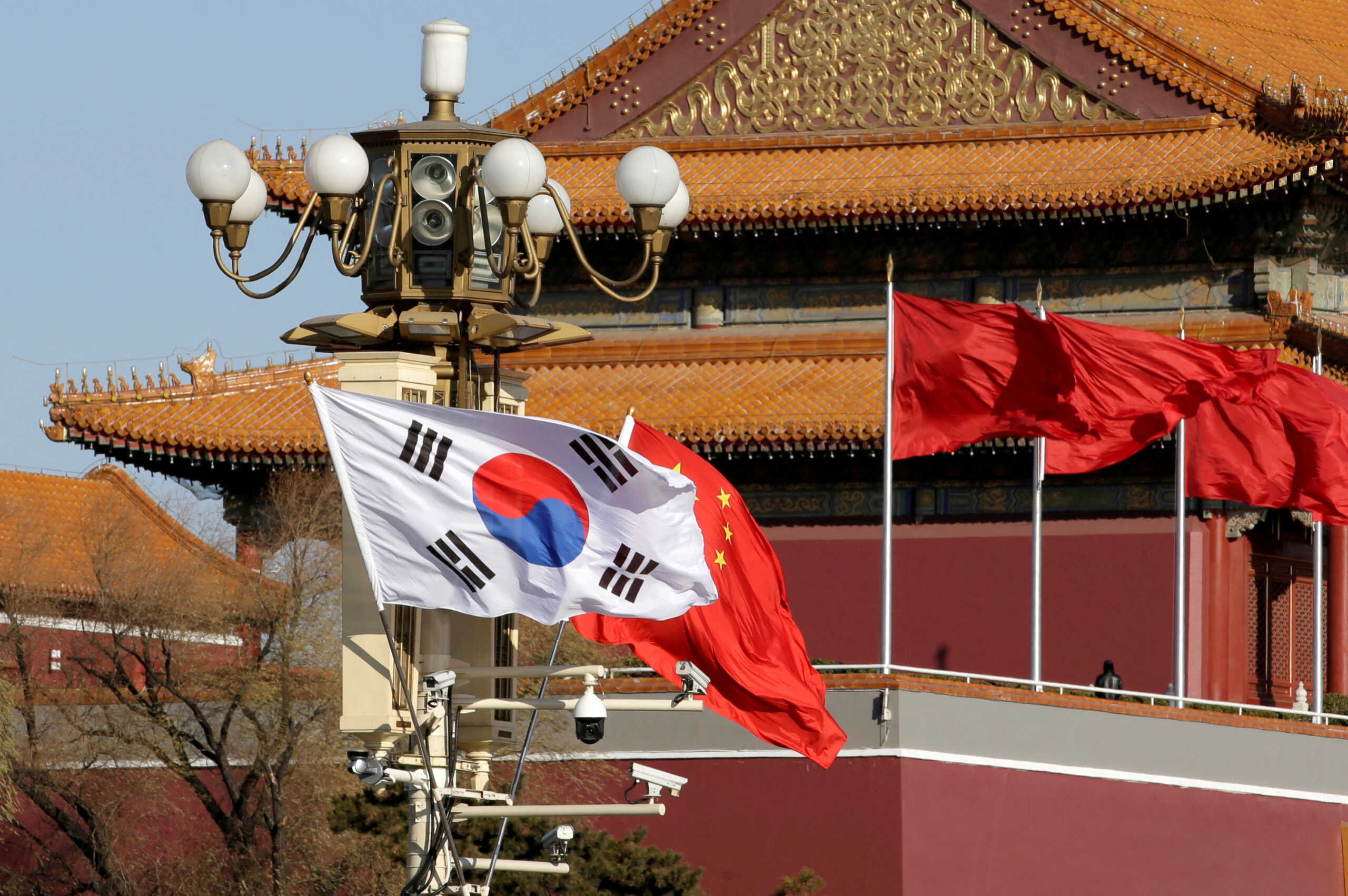 South Korea and China's flags flutter next to Tiananmen Gate during the visit of South Korean President Moon Jae-In in Beijing, China December 15, 2017. REUTERS