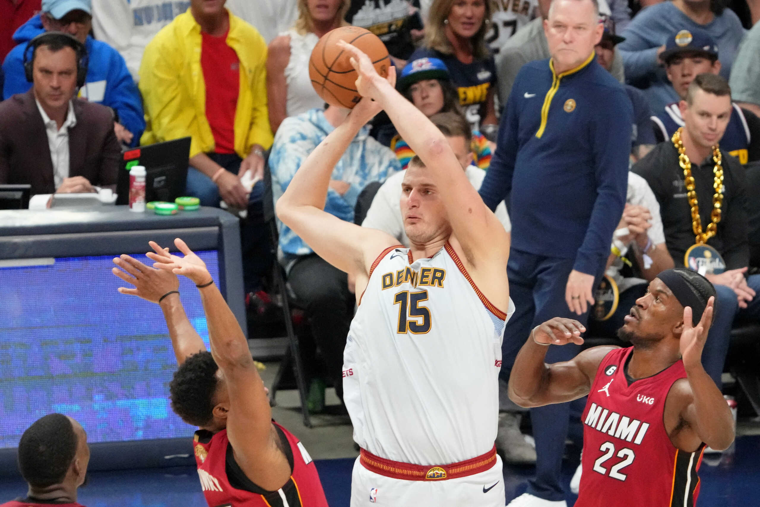 Jun 12, 2023; Denver, Colorado, USA; Denver Nuggets center Nikola Jokic (15) controls the ball againstMiami Heat guard Kyle Lowry (left) and forward Jimmy Butler (22) during the second quarter in game five of the 2023 NBA Finals at Ball Arena. Mandatory Credit: Kyle Terada-USA TODAY Sports